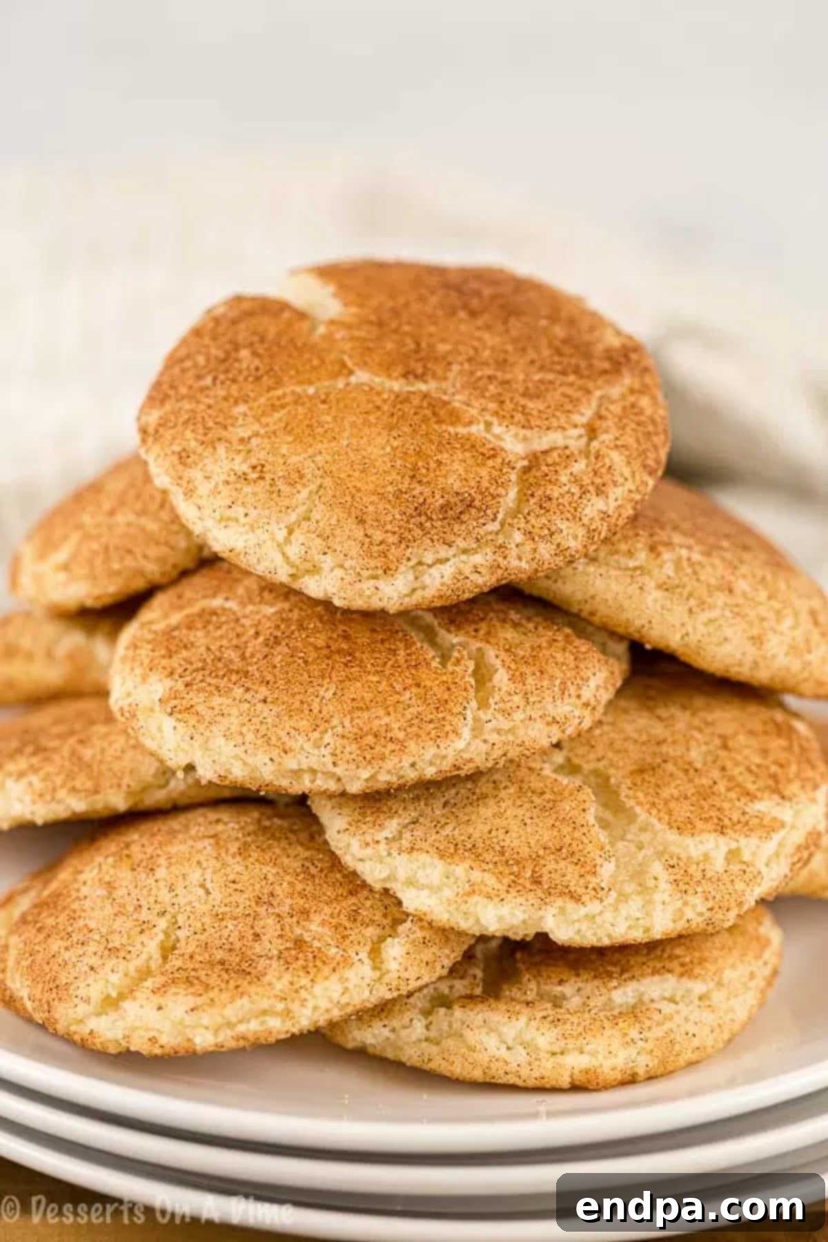 Simple Snickerdoodle Perfection 8 A platter of freshly baked Snickerdoodle cookies, ready to be served.