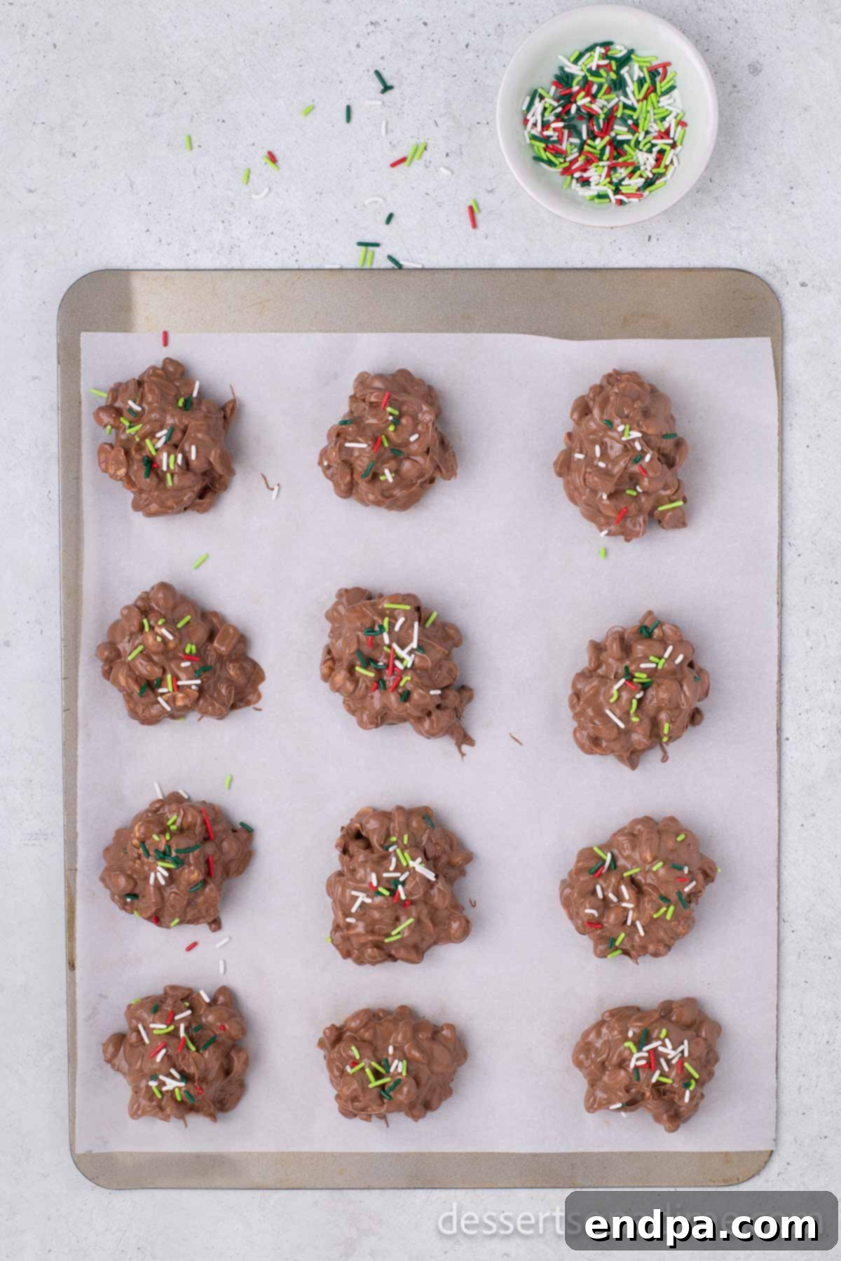 Christmas sprinkles on top of each candy cluster.