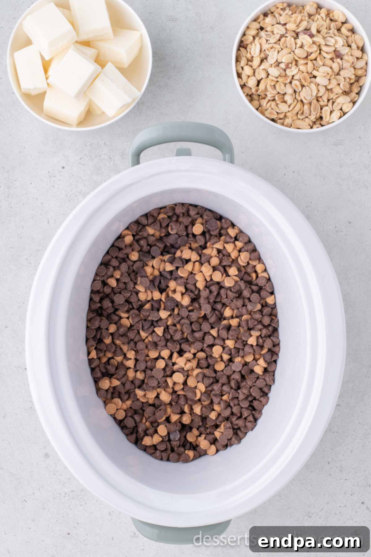 Chocolate chips layered in a crock pot.