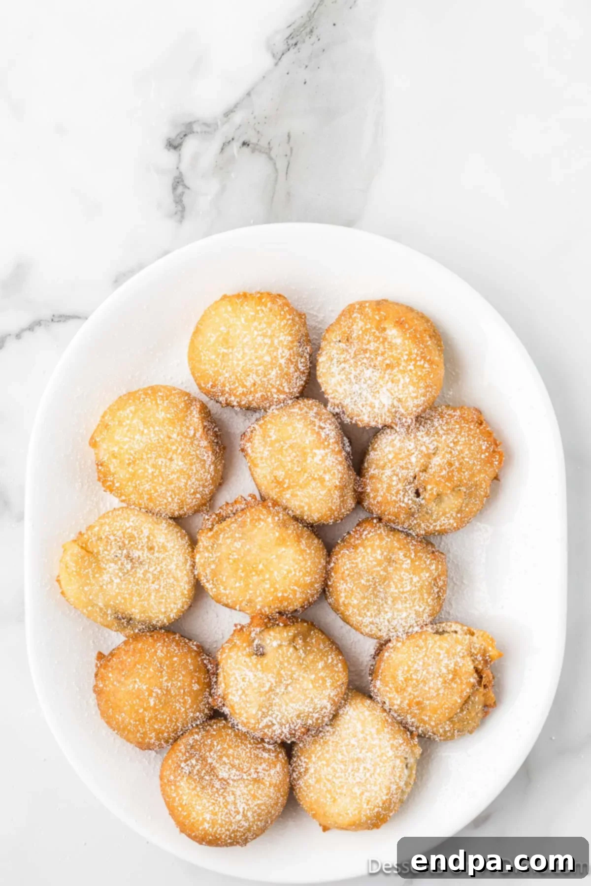 Powdered sugar sprinkled on top of fried Reece's cups.