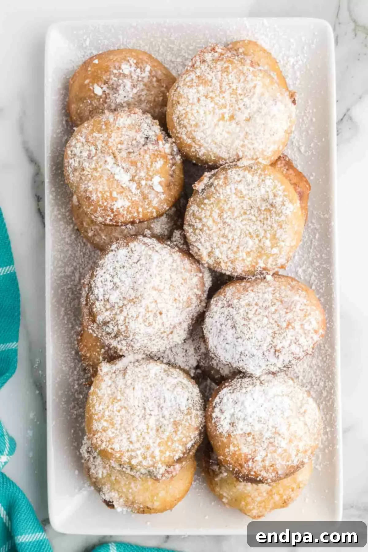 Deep fried reese's peanut butter cups on a platter.