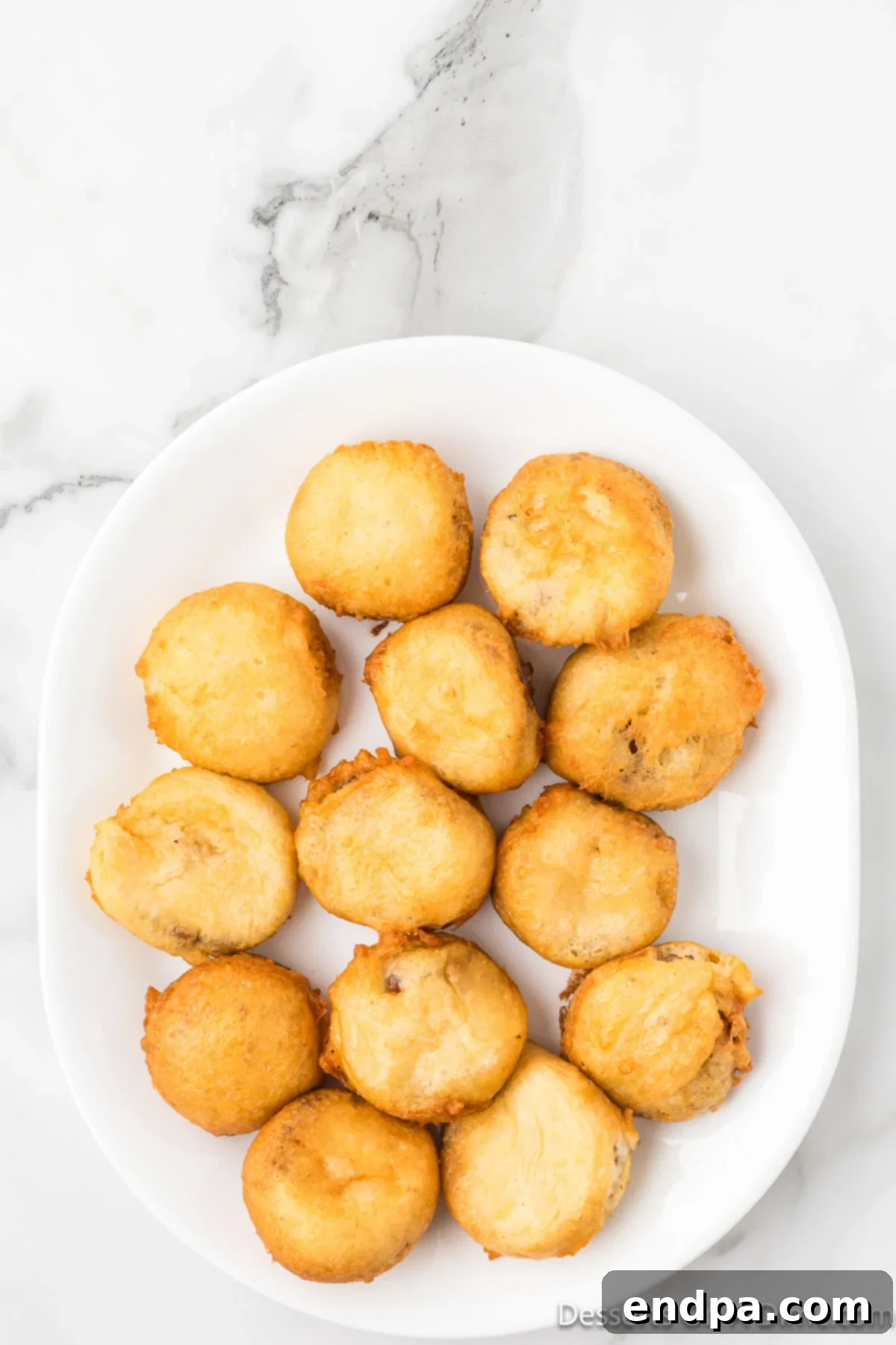 Fried Reece's Cups placed on plate.