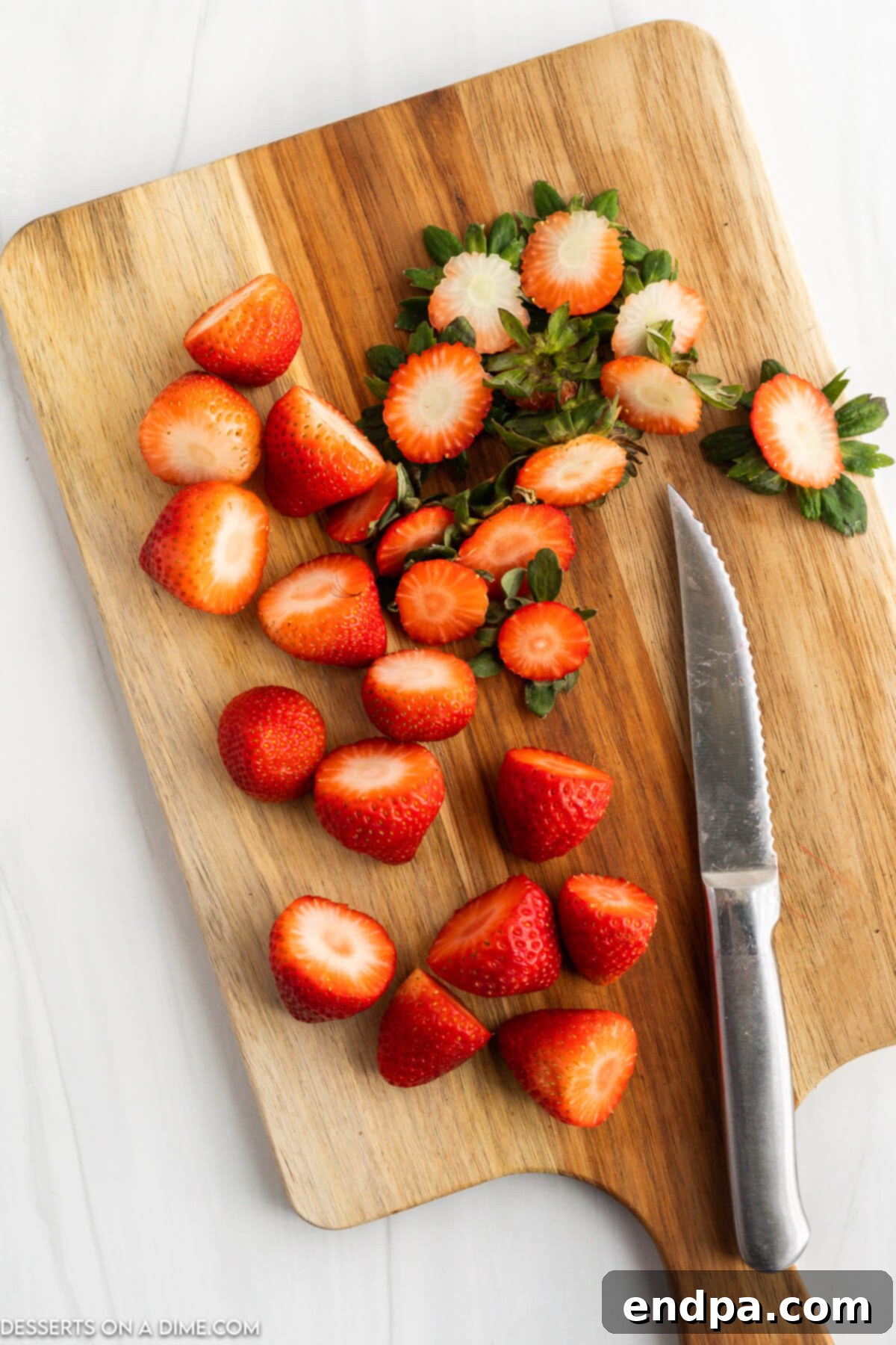 Strawberries with the tops neatly cut off, ready for assembly.