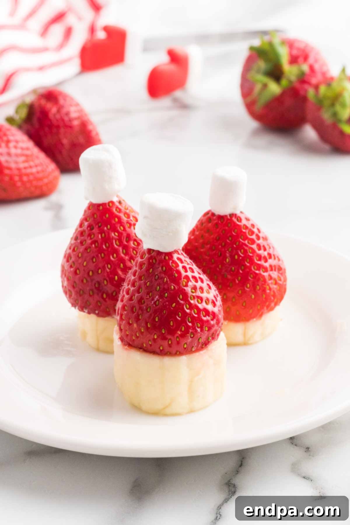 A festive platter of Strawberry Santa Hats, perfectly arranged for a holiday party.