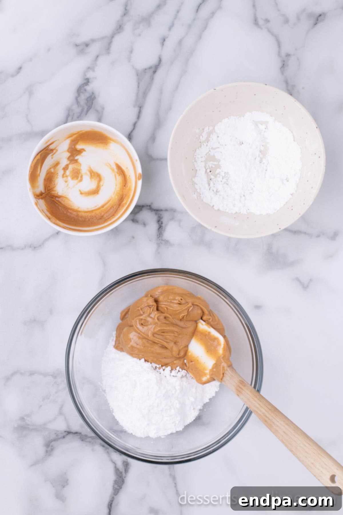 Peanut Butter Brownie Bliss Bites 4 Powdered sugar and creamy peanut butter in a mixing bowl.