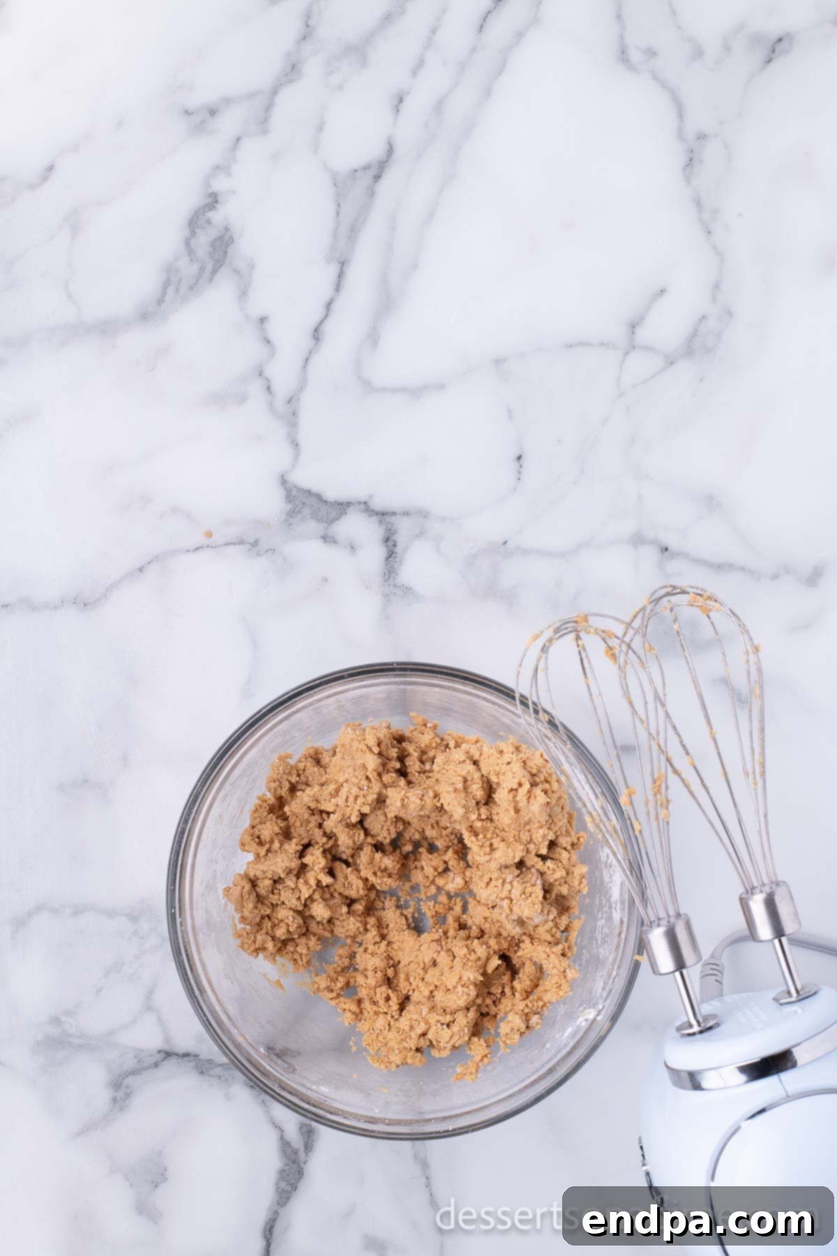 Peanut Butter Brownie Bliss Bites 5 Peanut butter and powdered sugar mixture combined into a smooth dough in a bowl.
