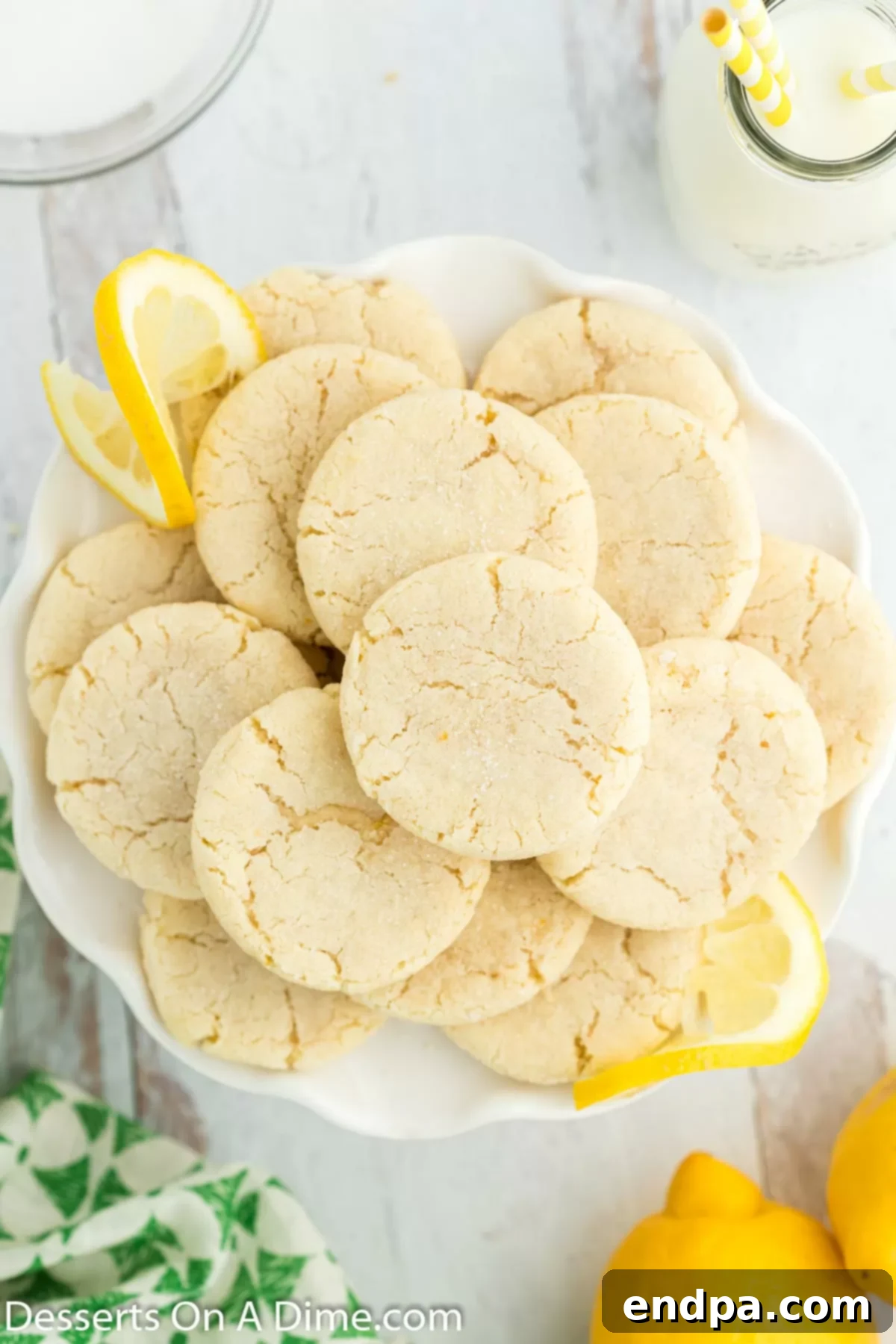 A beautiful platter filled with numerous freshly baked Lemon Sugar Cookies, ready for serving.