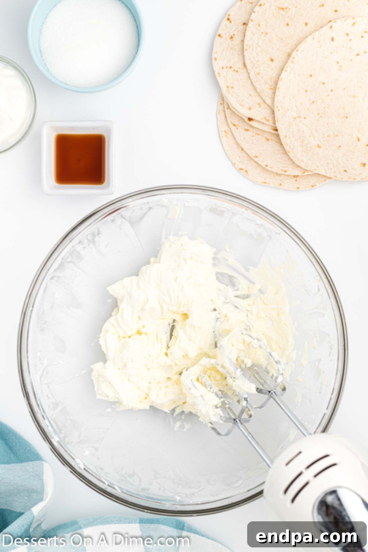 Crispy Cheesecake Chimis 4 Mixing bowl with softened cream cheese, ready to be beaten.