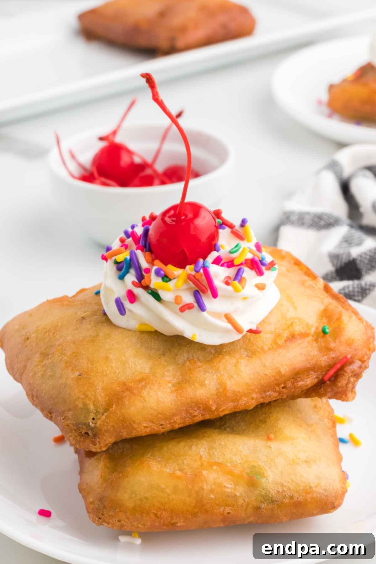 Crispy Sweet Pop Tart Delight 2 Deep fried pop tarts with toppings including whipped cream, sprinkles, and cherries.