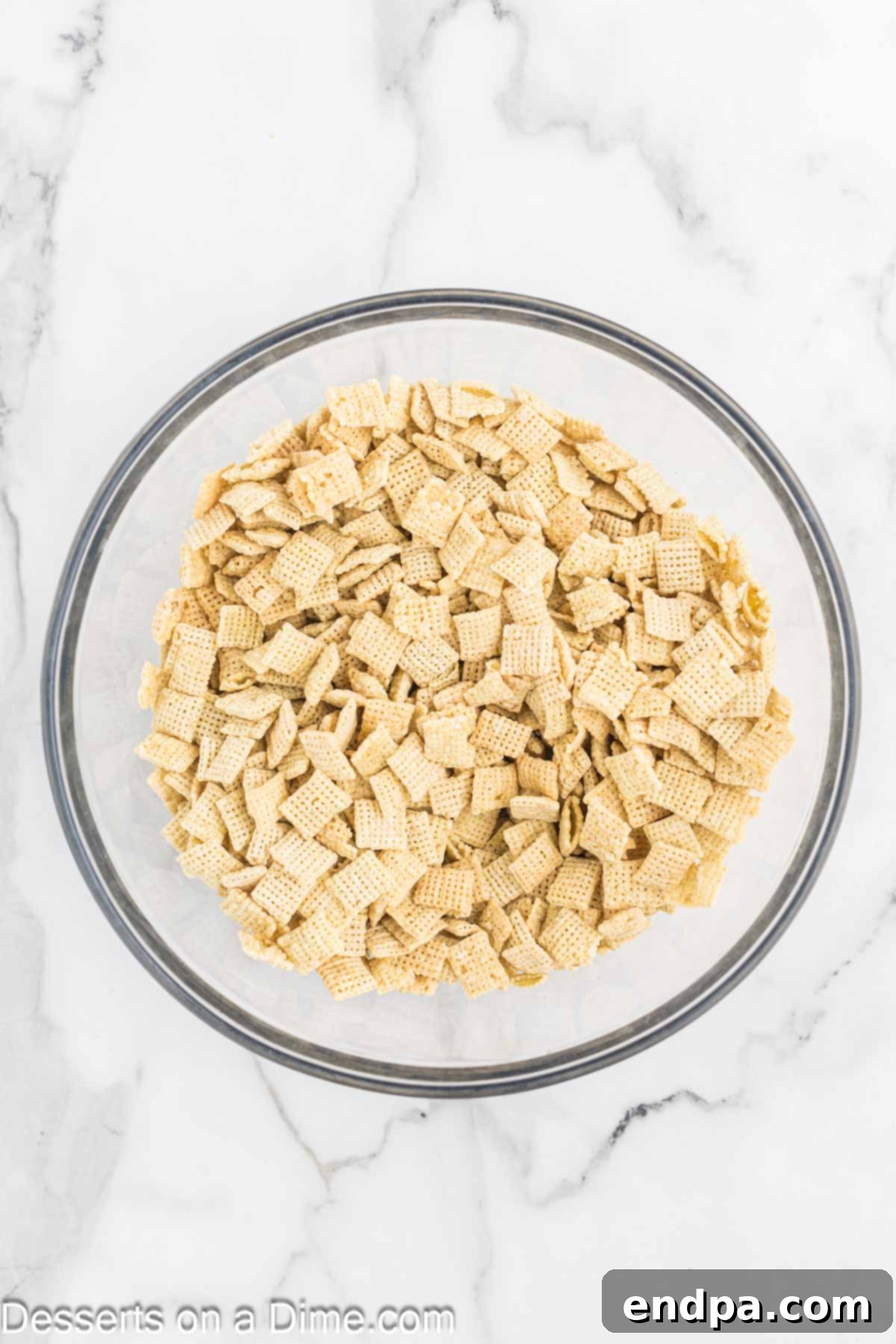 Decadent Hot Chocolate Puppy Chow 5 Chex cereal in a large mixing bowl.
