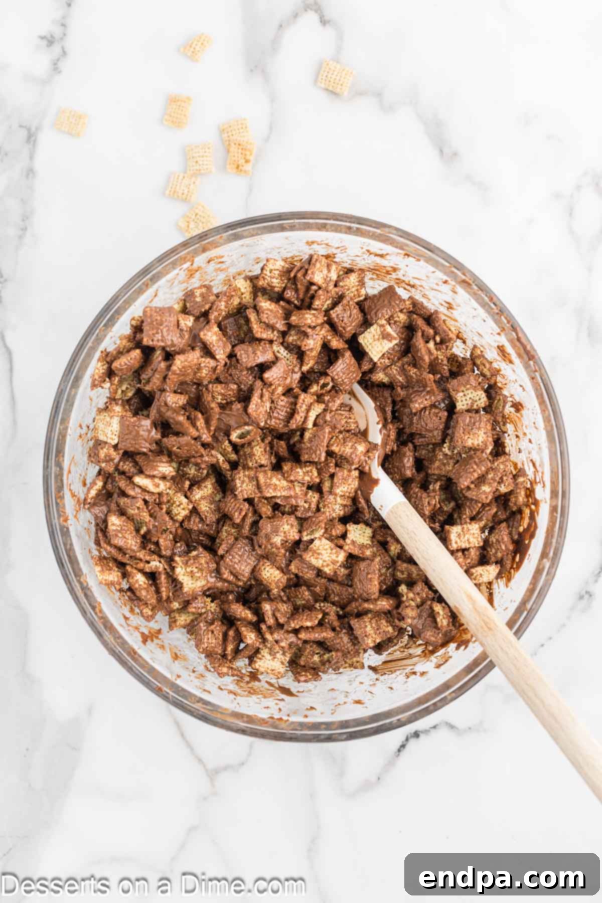 Decadent Hot Chocolate Puppy Chow 6 Chex cereal coated with melted chocolate in a bowl.
