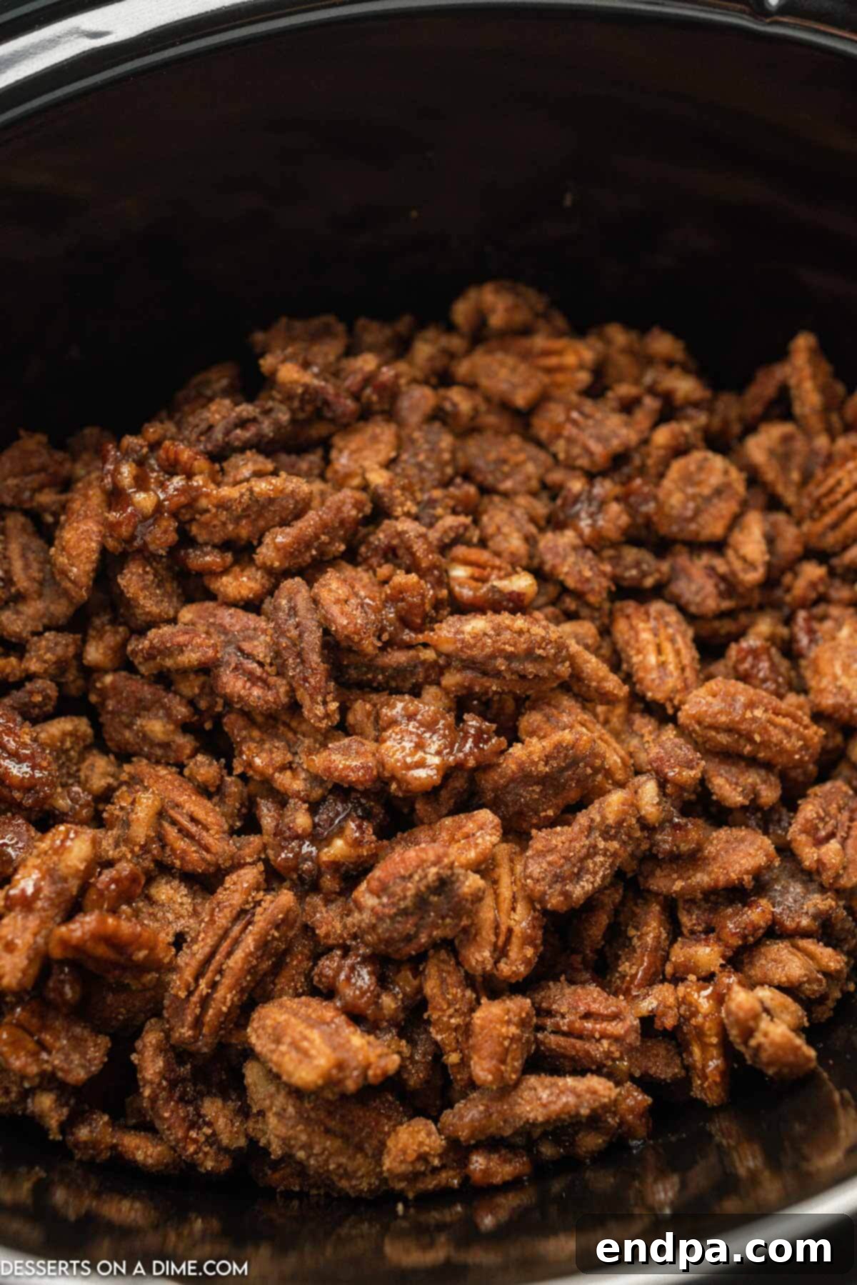 Slow cooker candied pecans in the crock pot. 