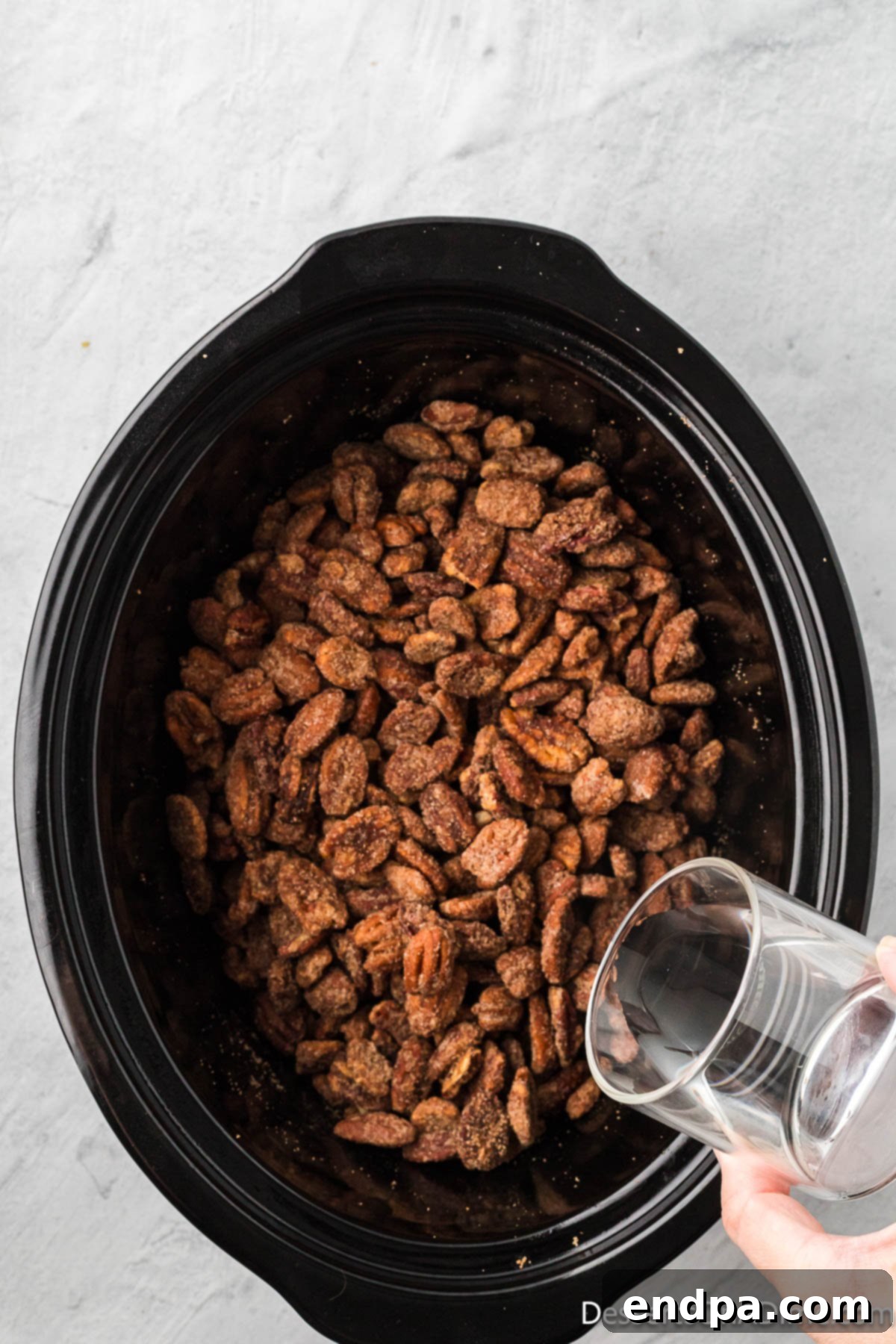 Water added to slow cooker. 