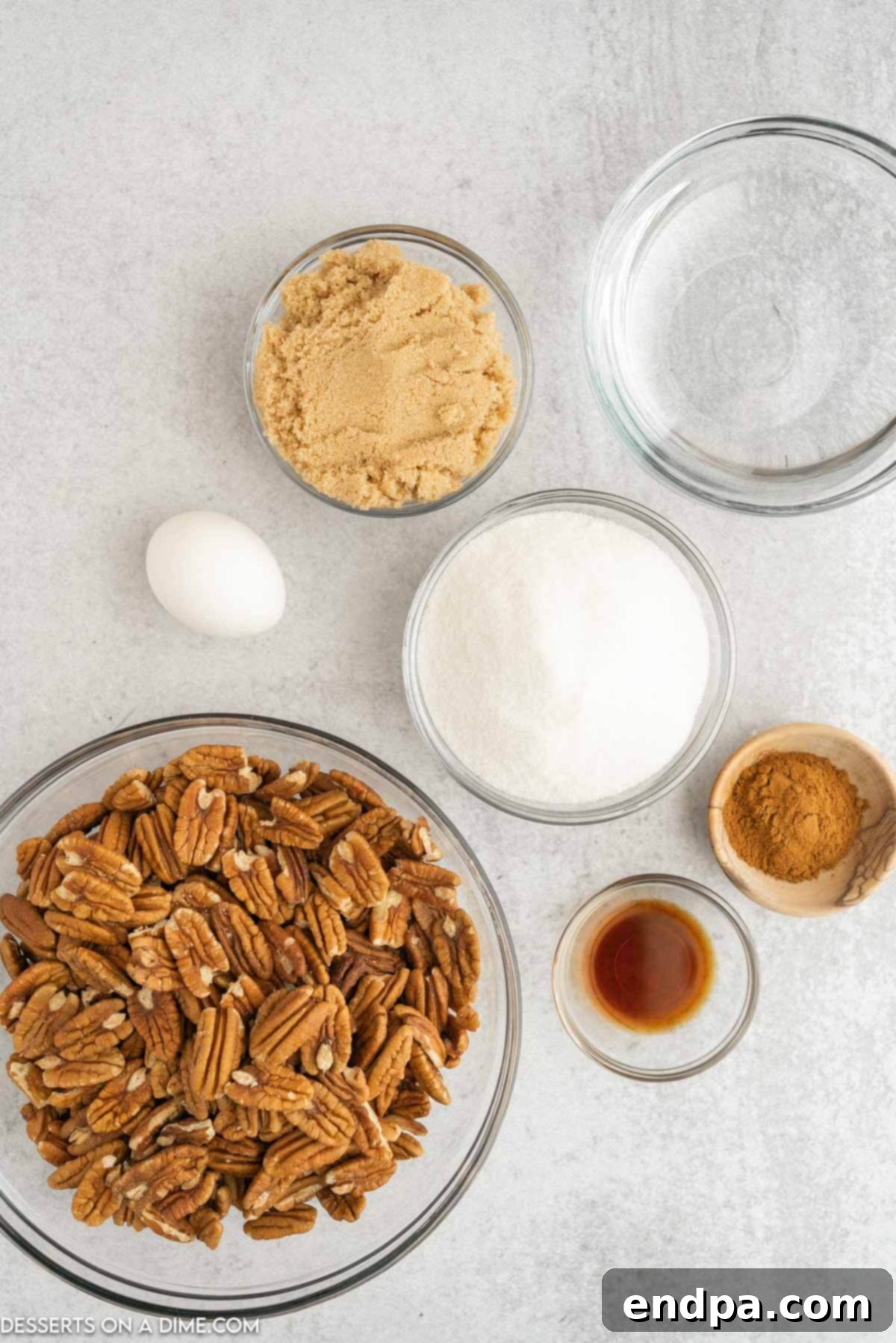 Ingredients for Slow cooker candied pecans - pecan halves, egg whites, vanilla extract, brown sugar, cinnamon, cooking spray. 