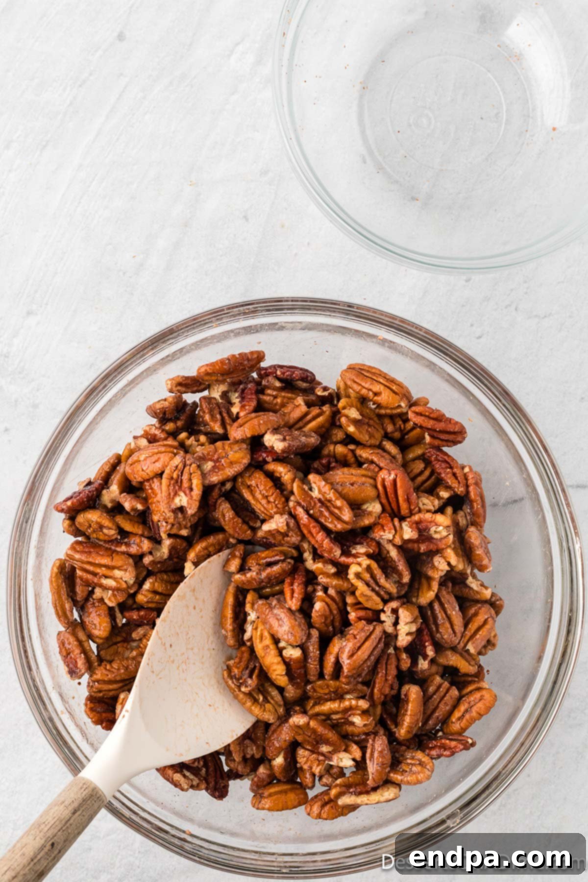 Egg white mixture poured over pecans. 