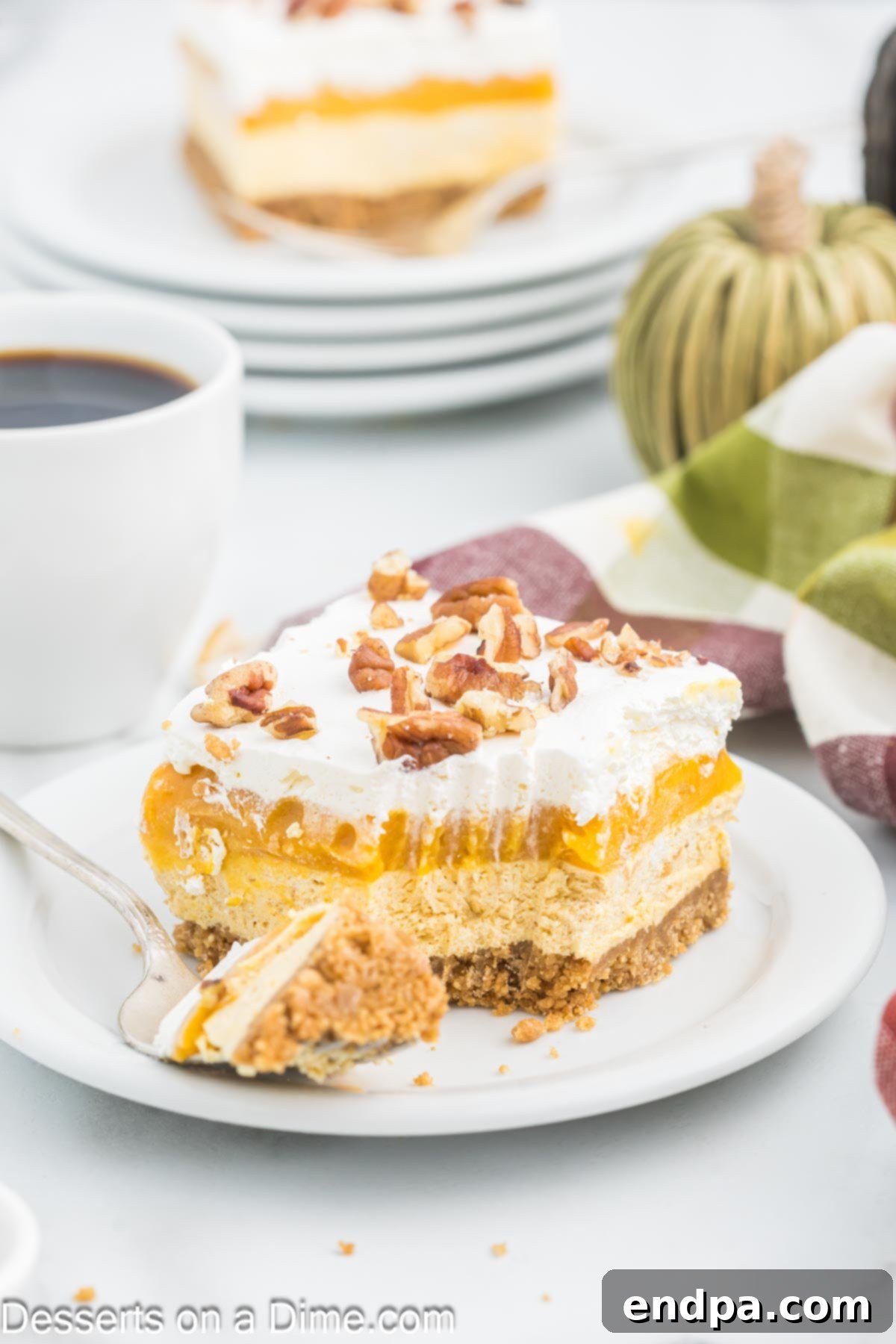 Spiced Pumpkin Cloud Bars 2 Slice of Pumpkin Dream Bar on a plate.
