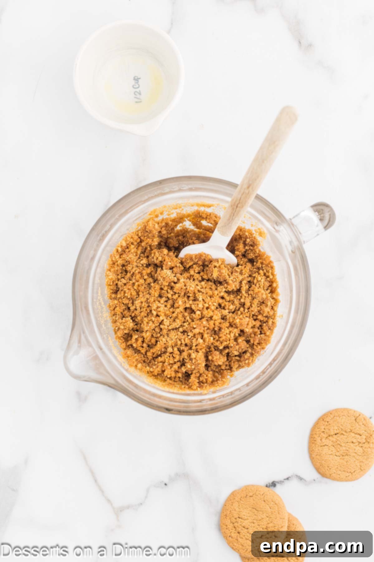 Spiced Pumpkin Cloud Bars 4 Mixing bowl of crushed cookies and butter.