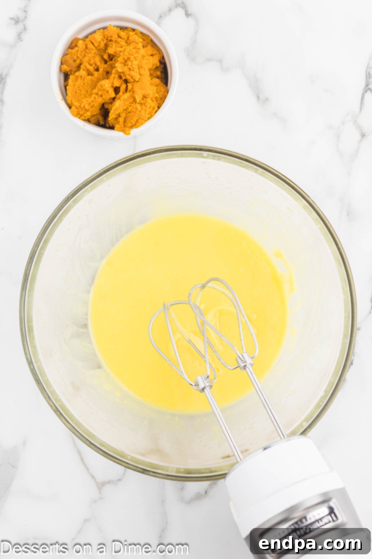 Spiced Pumpkin Cloud Bars 6 Mixing bowl with milk and pudding mix combined together.