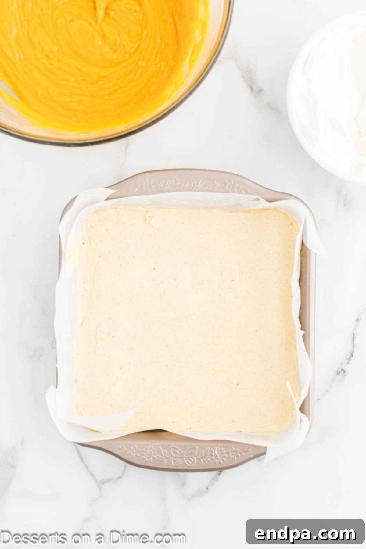 Spiced Pumpkin Cloud Bars 8 Cream cheese layer spread over crust.