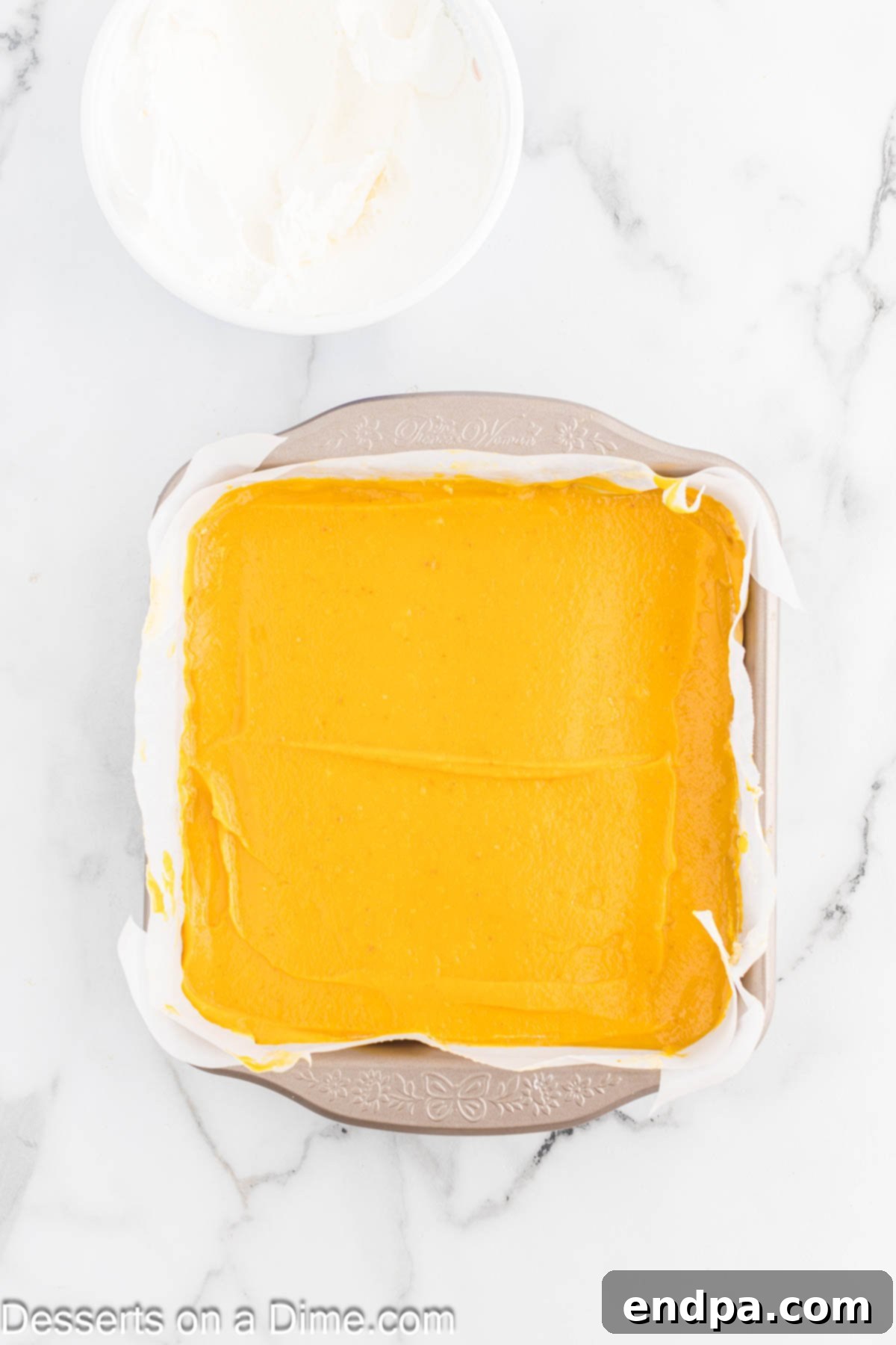 Spiced Pumpkin Cloud Bars 9 Pumpkin mixture spread over cream cheese layer.