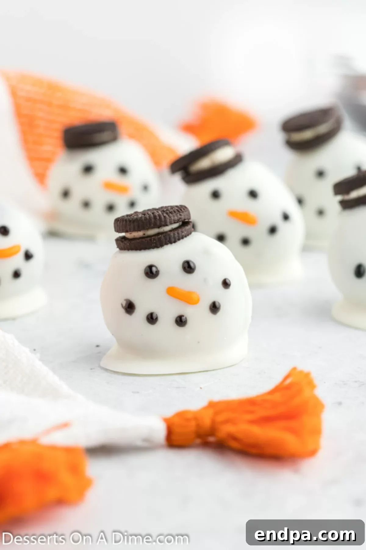 Frosty Oreo Delights 2 Snowman oreo balls grouped together.