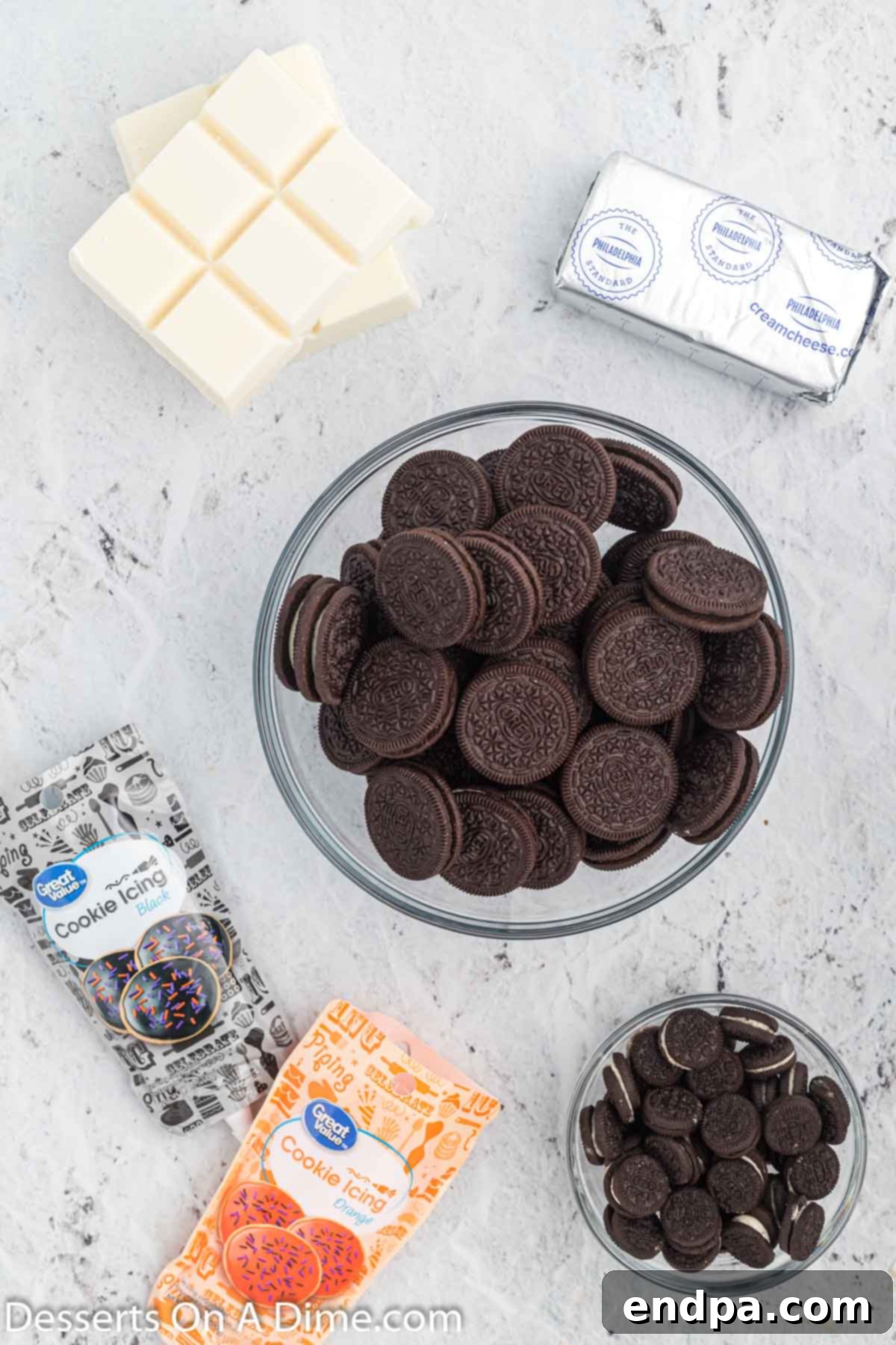 Frosty Oreo Delights 3 Ingredients for Snowman oreo balls- cream cheese, oreo cookies, icing, almond bark.