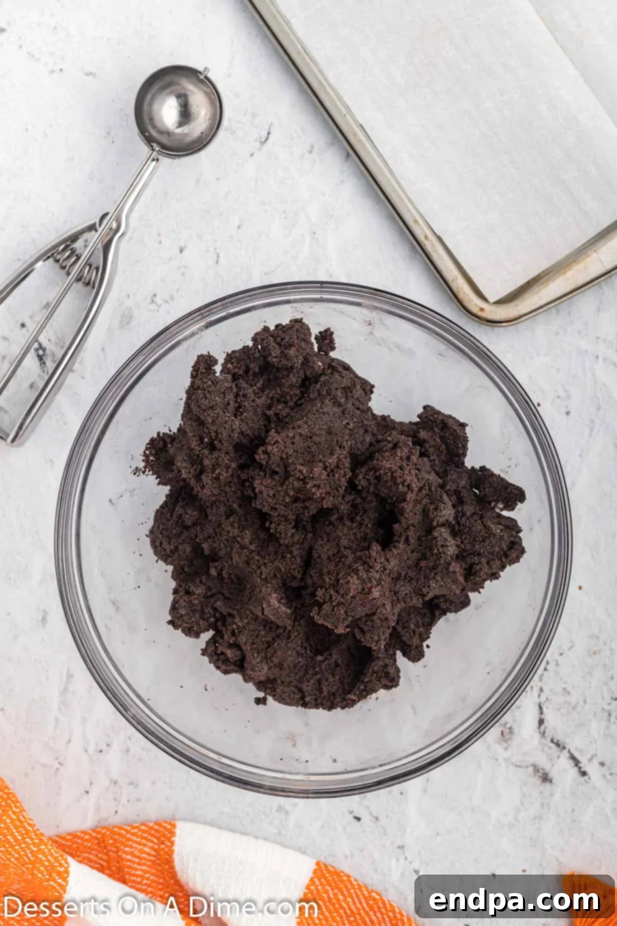 Frosty Oreo Delights 5 Crushed cookies and cream cheese combined in a bowl.