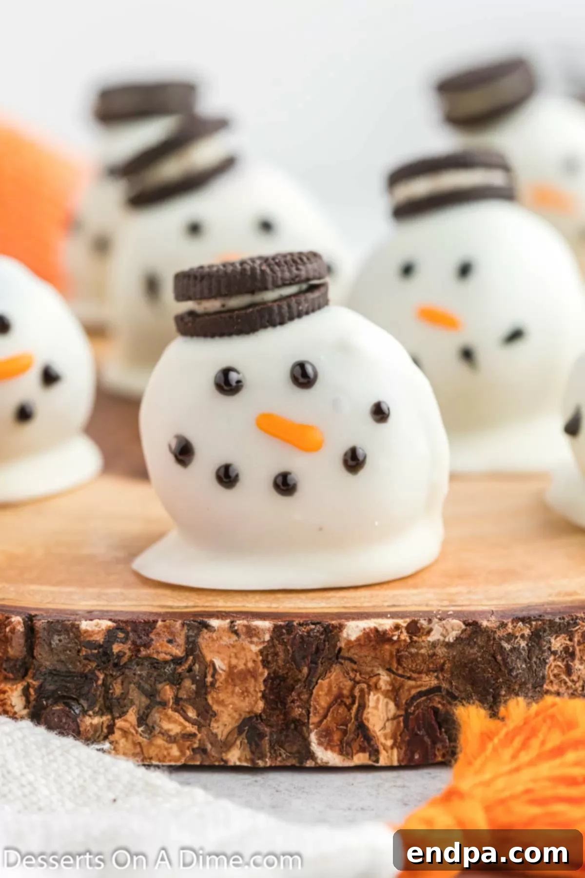 Frosty Oreo Delights 10 Snowman oreo balls grouped together.