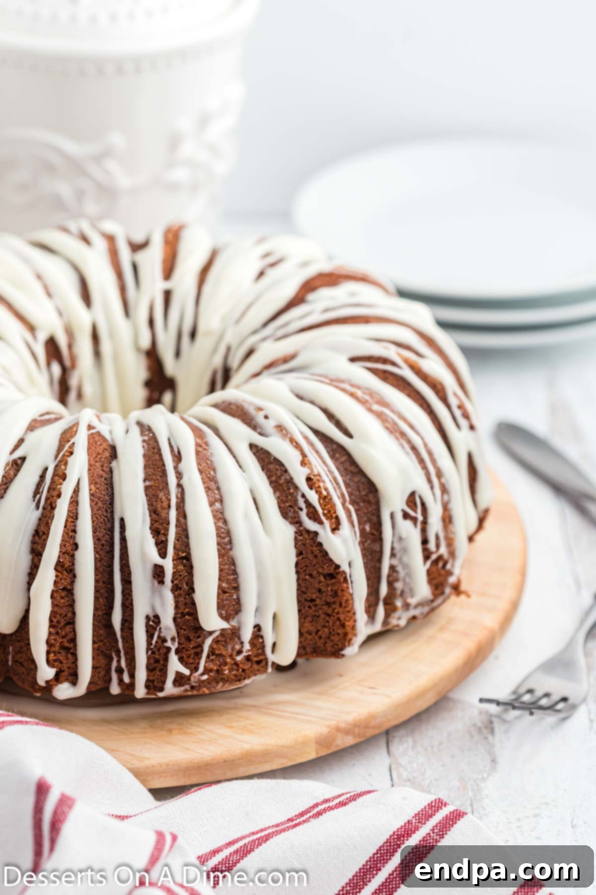 A beautifully baked Red Velvet Pound Cake, topped with a luscious cream cheese glaze, ready to be sliced and served.