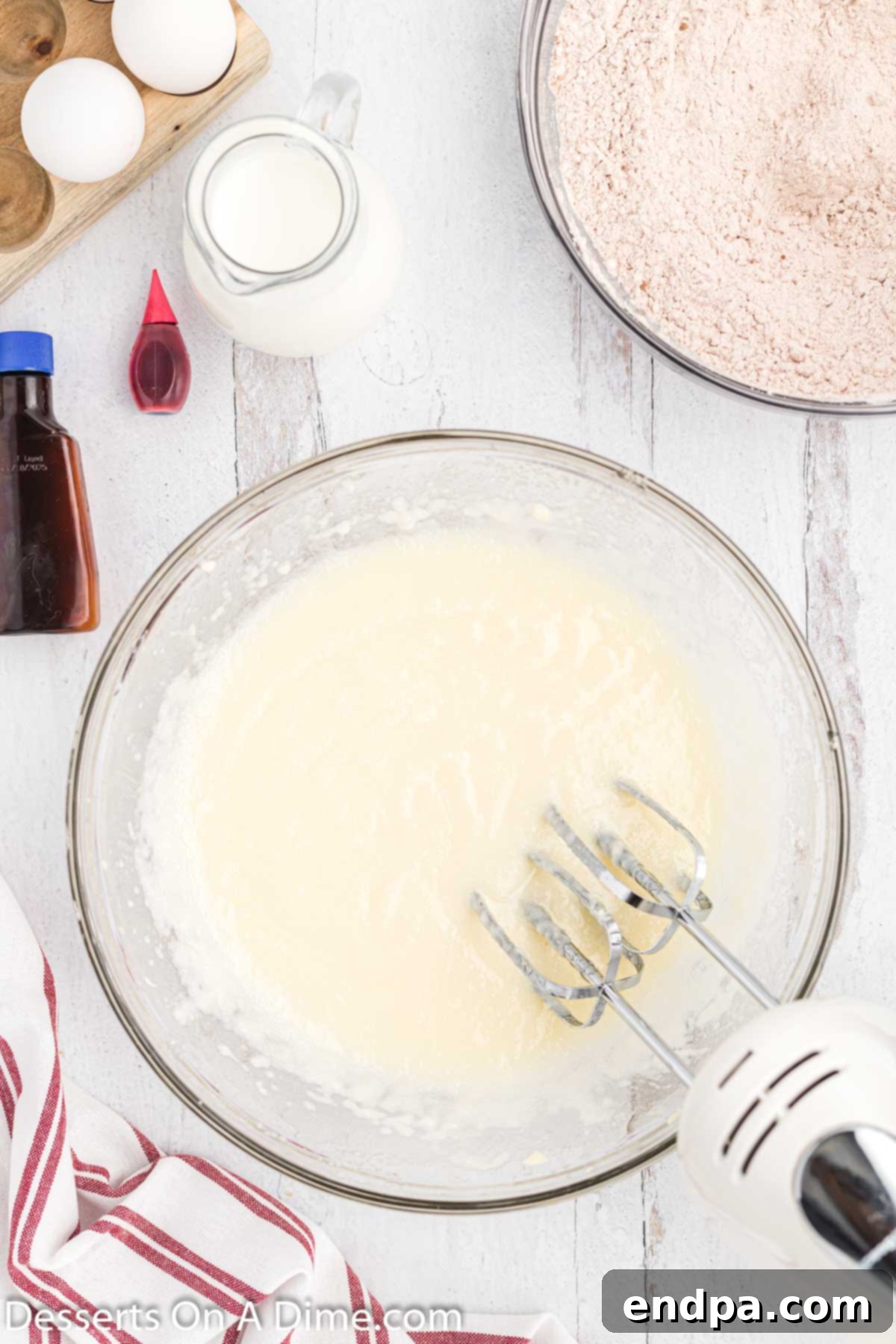 A separate mixing bowl containing oil, butter, and sugar, thoroughly combined and creamy.