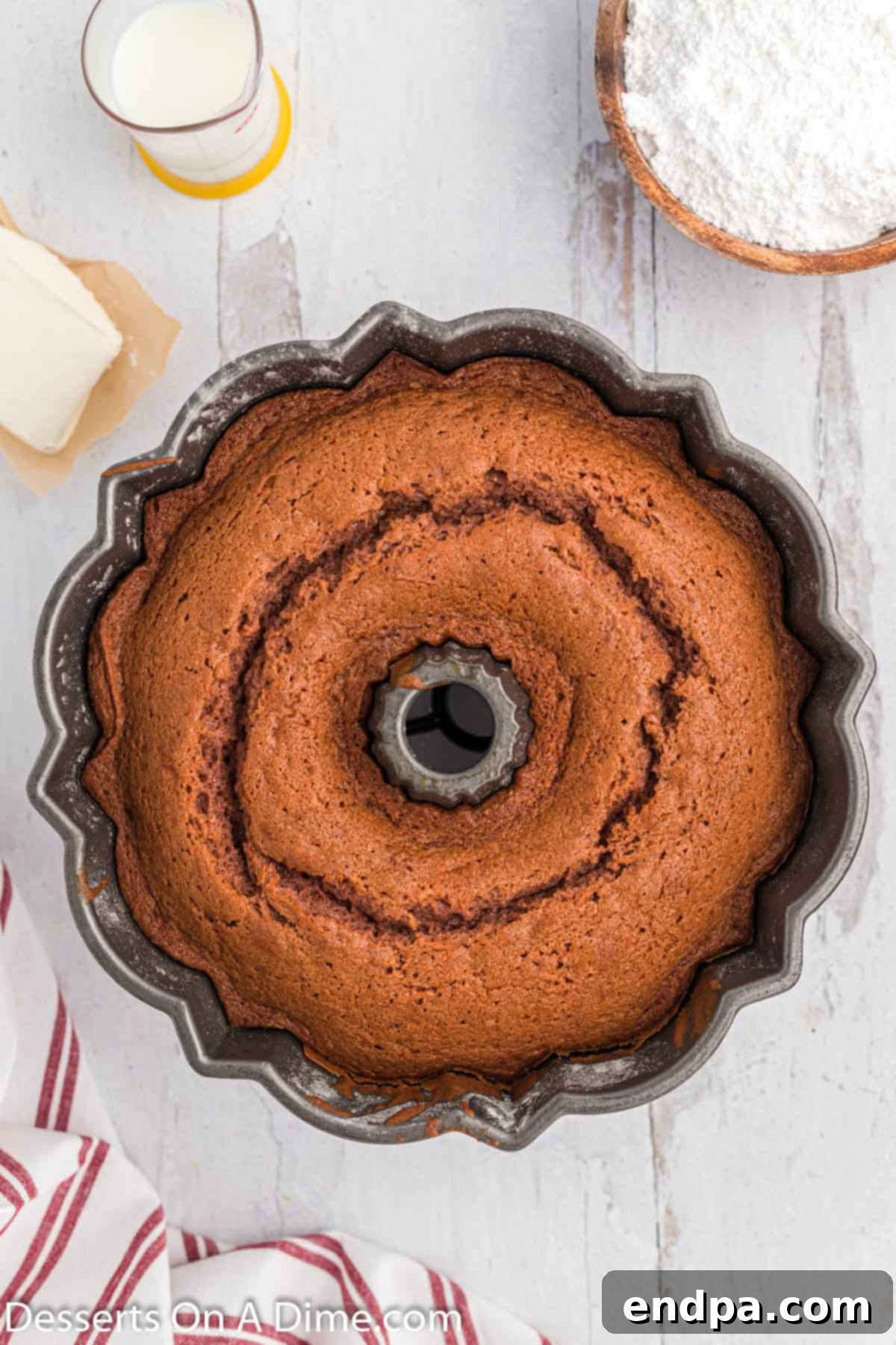 A freshly baked Red Velvet Pound Cake, removed from the oven and cooling in its pan.