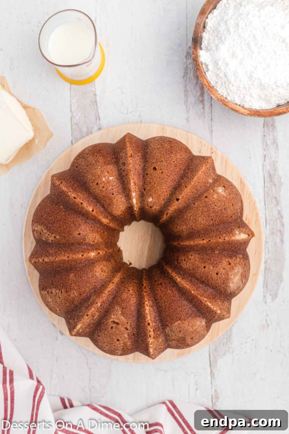 A perfectly baked Red Velvet Pound Cake, inverted onto a platter and ready for its finishing touches.