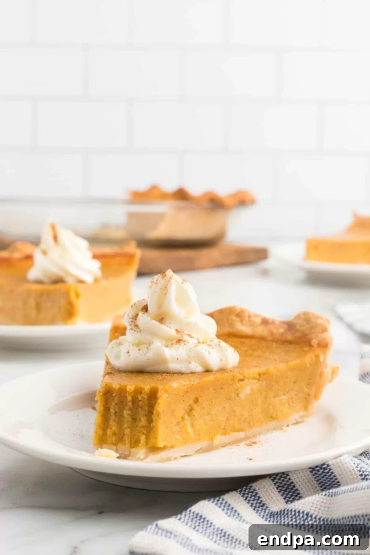 Golden Harvest Butternut Squash Pie 16 Close-up of a slice of Butternut Squash pie, showcasing its creamy texture.