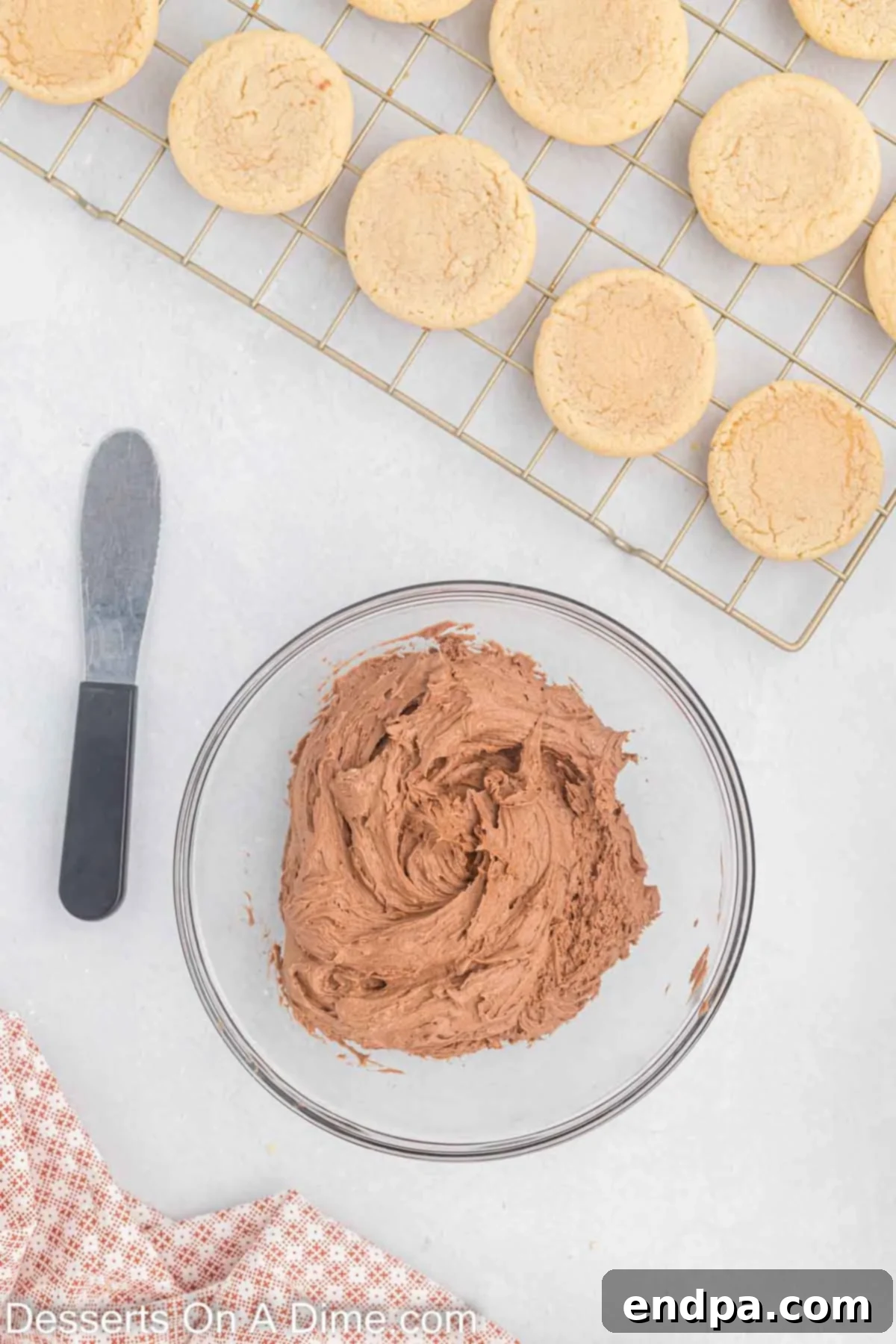 Milk and vanilla extract being added to the chocolate frosting ingredients.