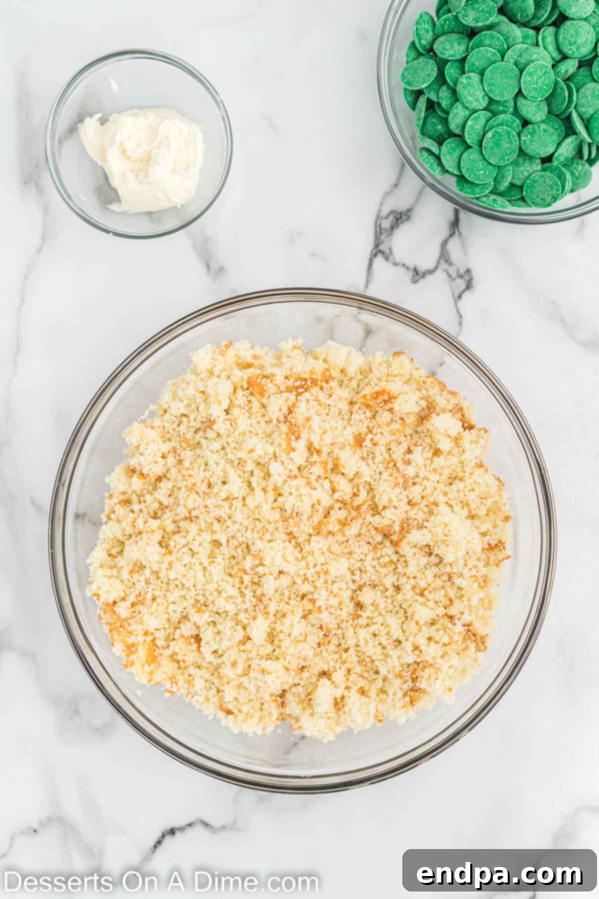 Mixing bowl with cake crumbles, ready for frosting.