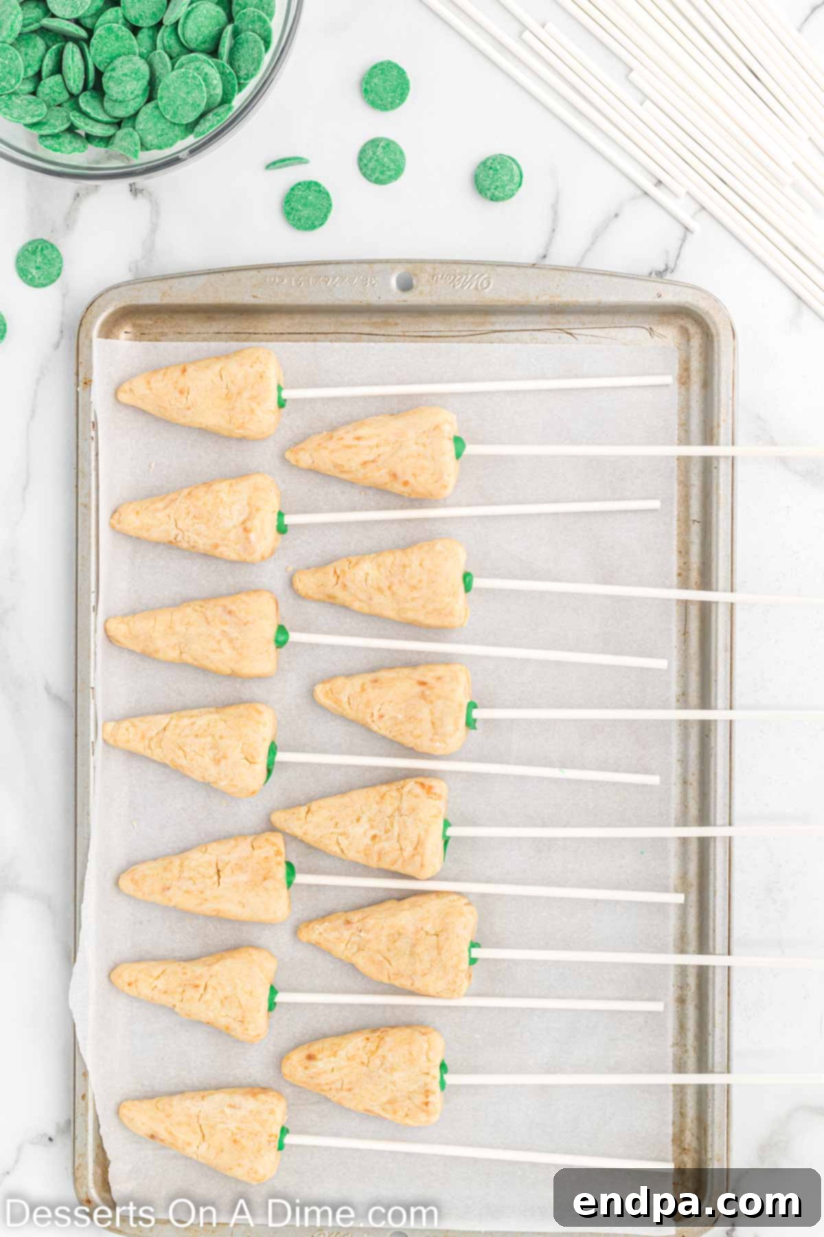 Lollipop sticks inserted into the bases of the cake tree cones.