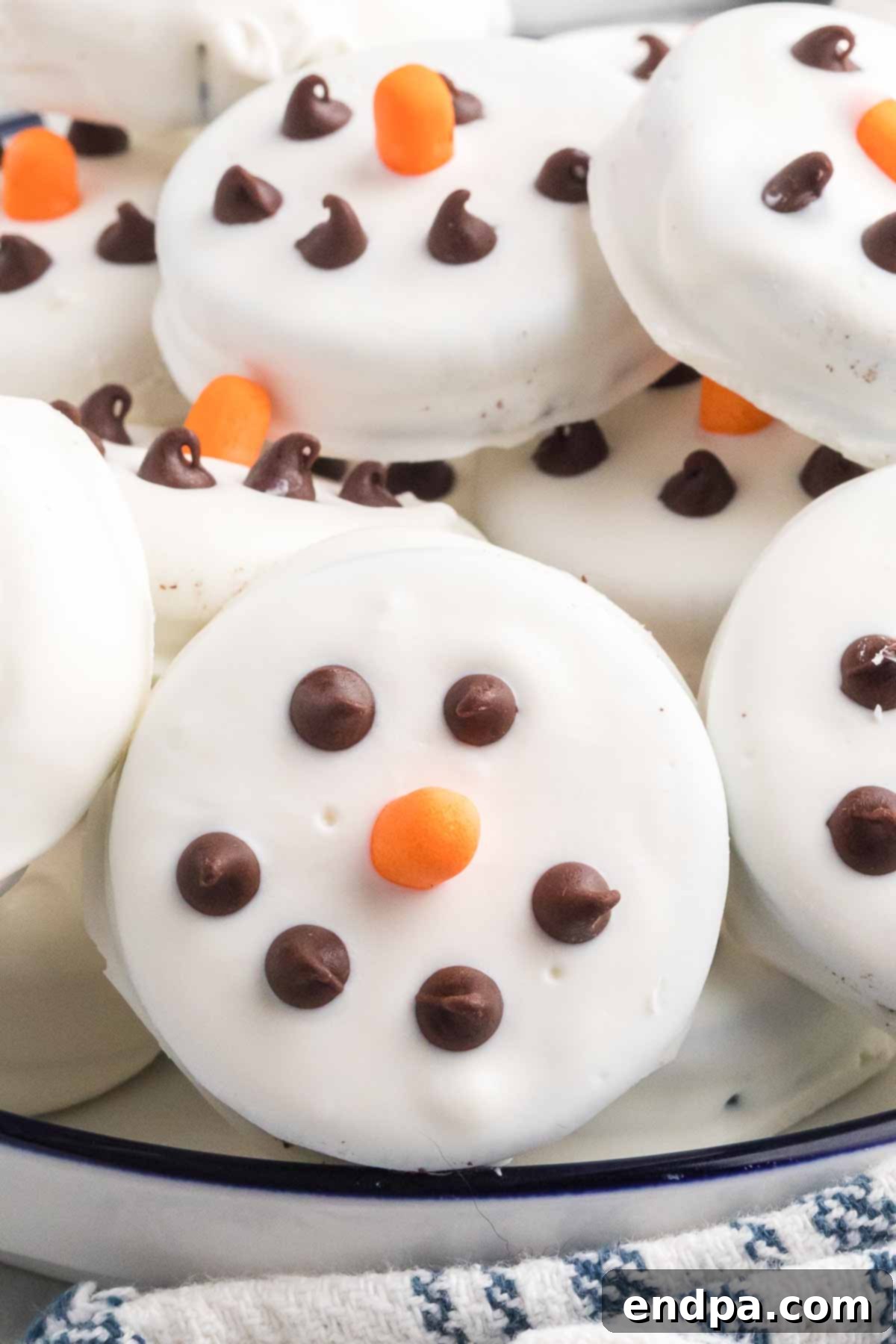 Whimsical Snowman Oreo Delights 2 Snowman Oreos stacked together, showcasing the festive decoration.