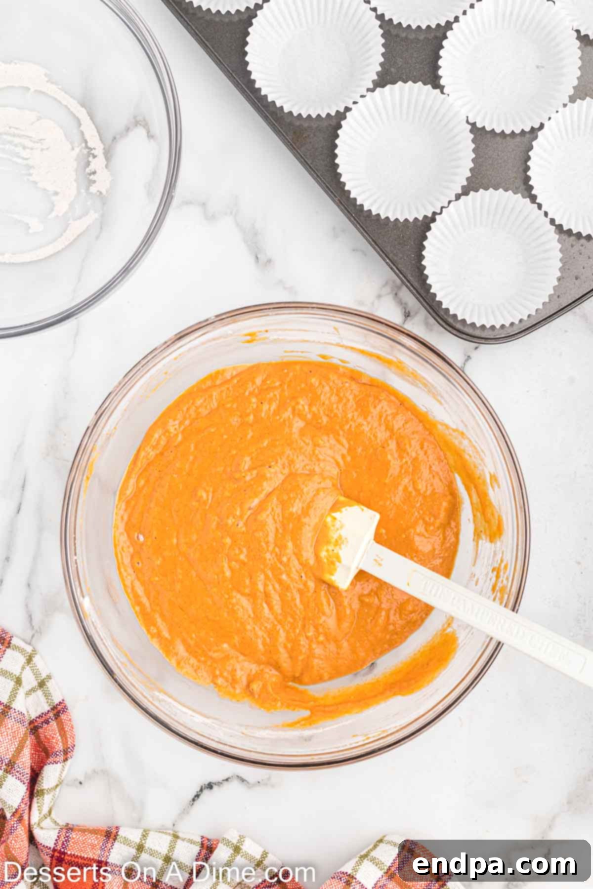 Combine the wet and dry ingredients together in a bowl, mixing until just combined.