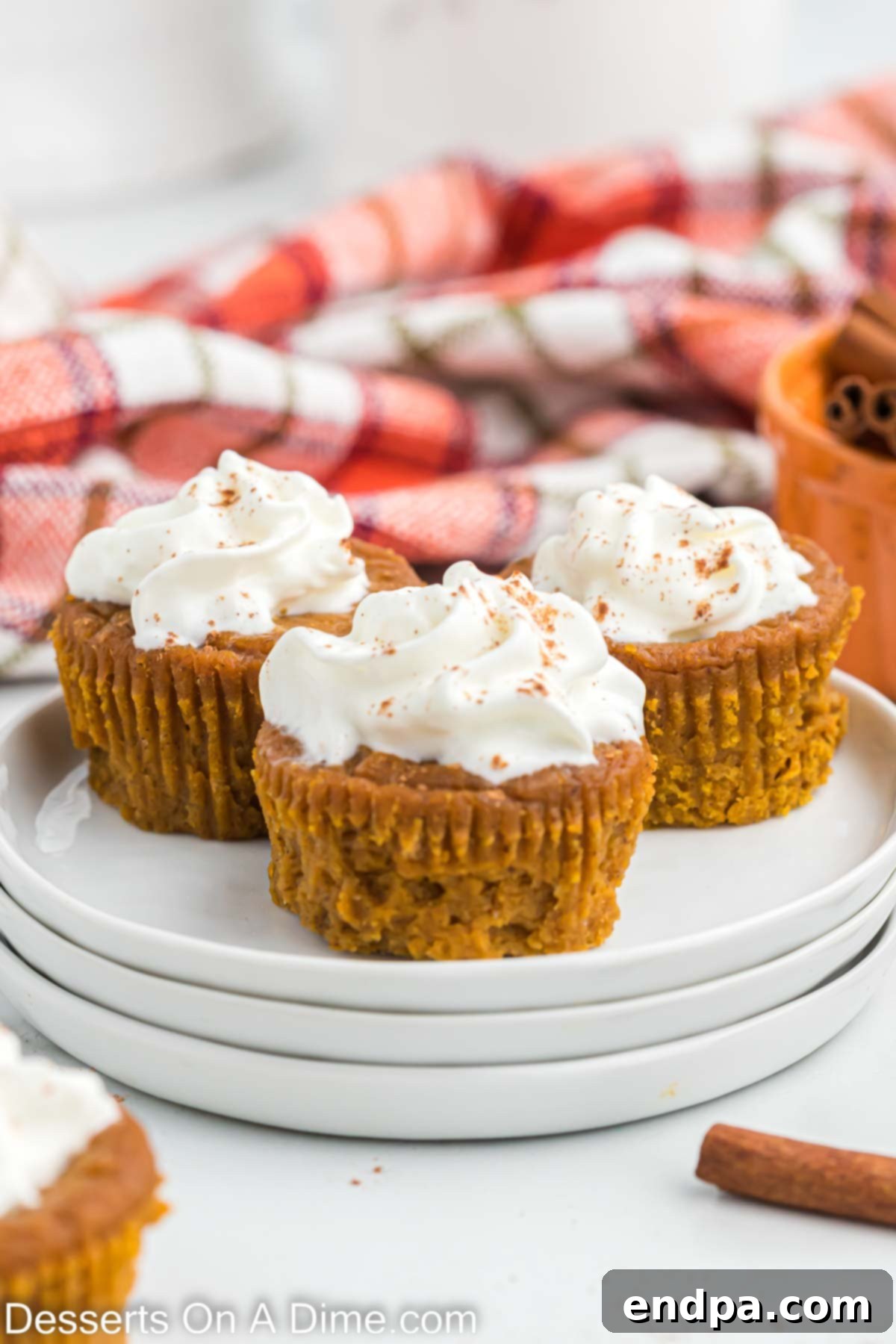 Pumpkin pie cupcakes on a plate, ready to be enjoyed.