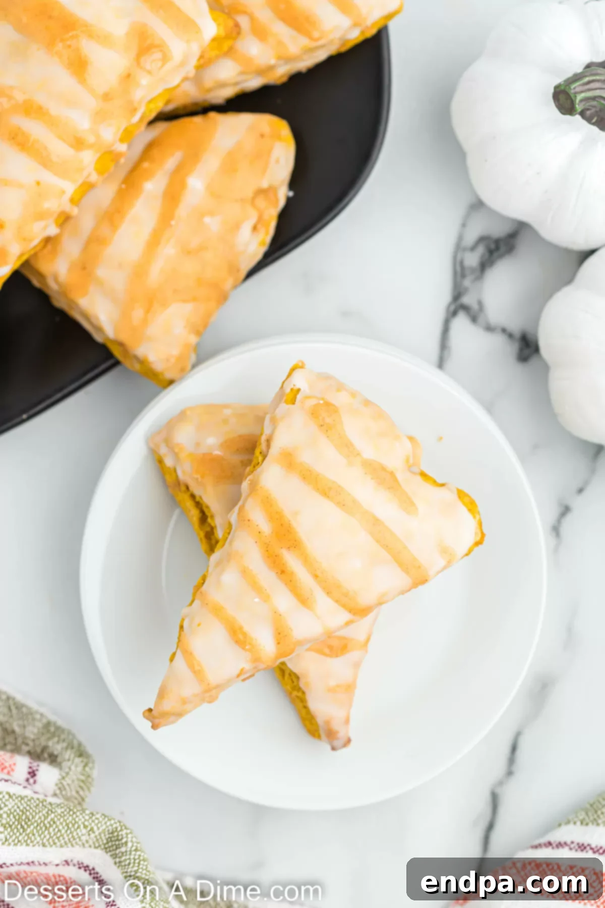 Freshly baked Starbucks pumpkin scones on a plate, ready to be enjoyed.