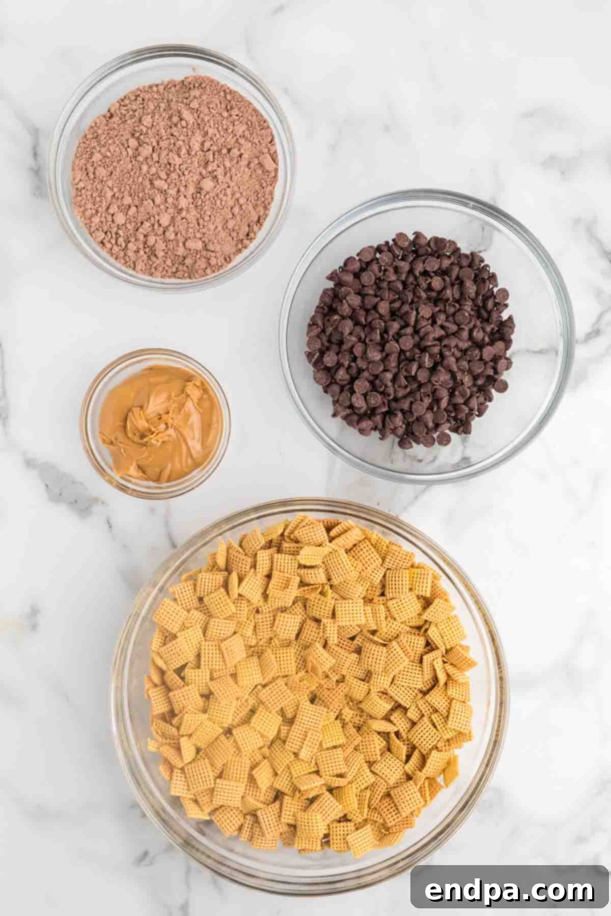 Double Fudge Brownie Crunch 3 Ingredients for Brownie puppy chow including Chex cereal, chocolate chips, peanut butter, and brownie mix.