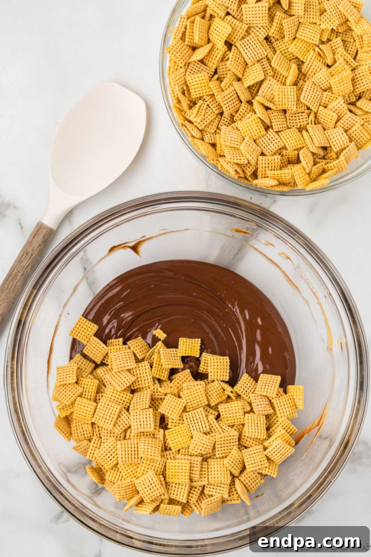 Double Fudge Brownie Crunch 6 Cereal poured into chocolate mixture.