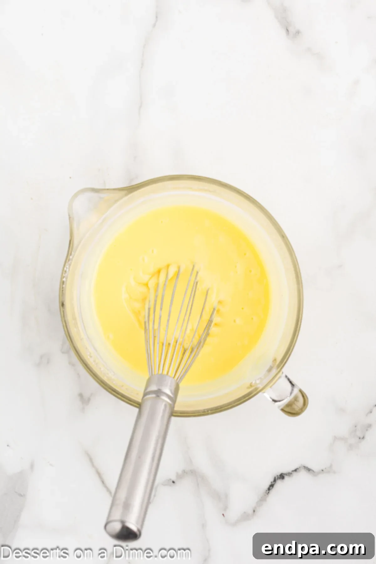 Pudding mixture combined in a bowl.