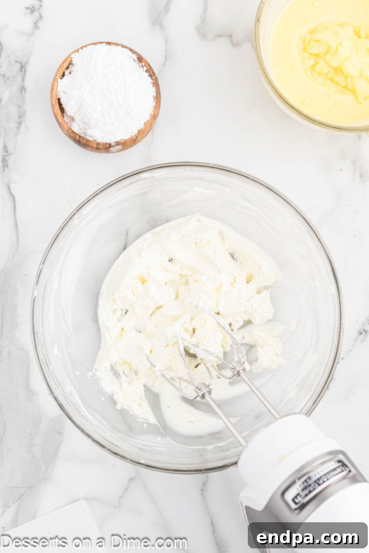 Cream cheese beat until fluffy in a bowl.
