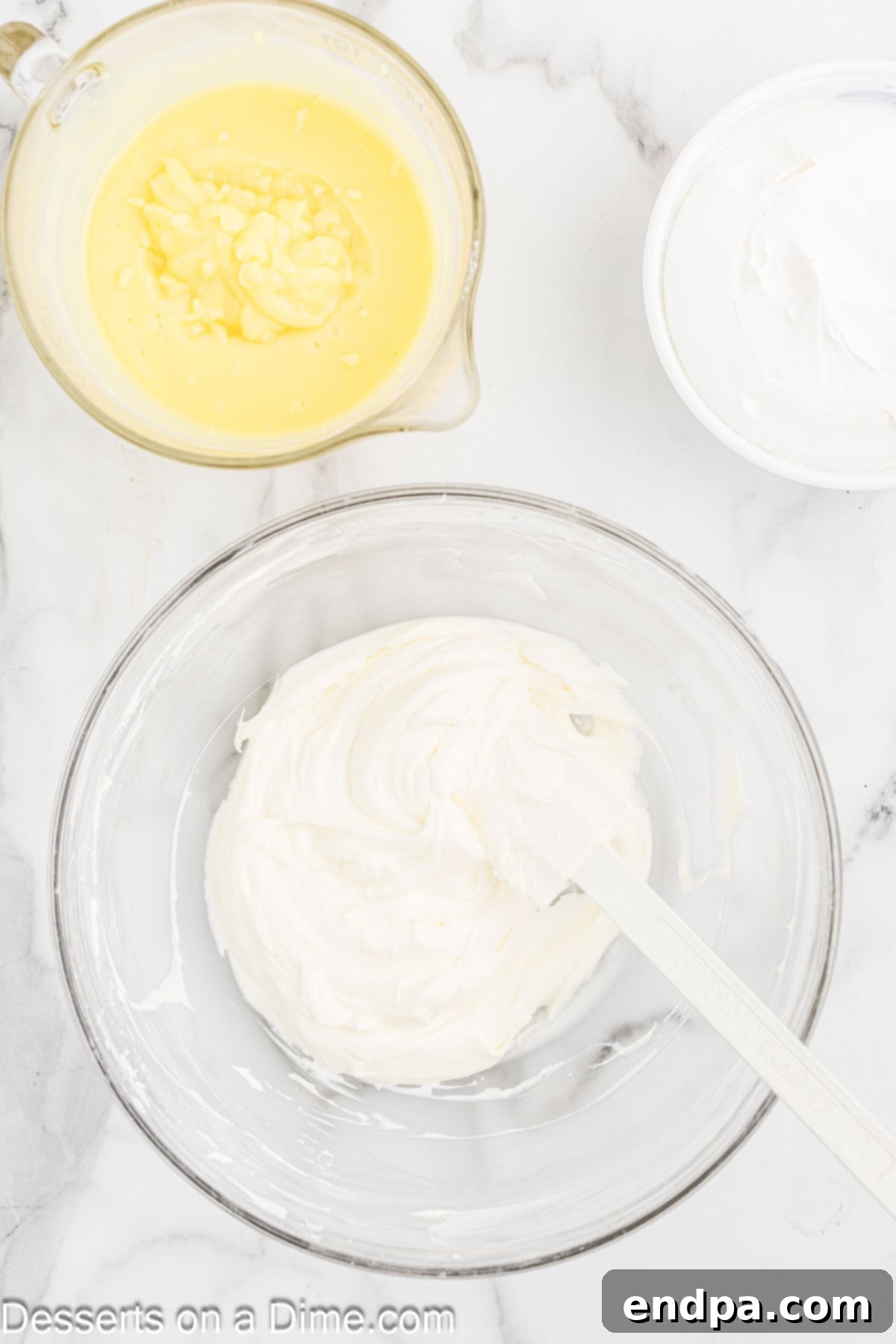 Powdered sugar mixed into cream cheese mixture.