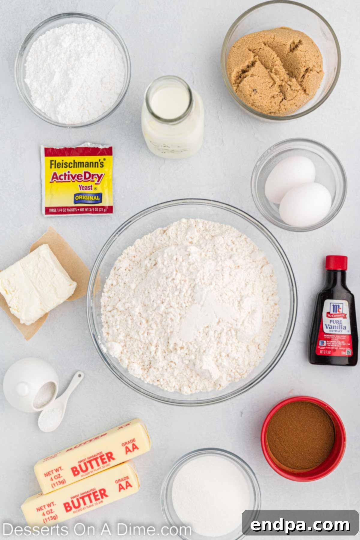 Crafting Perfect Cinnabon Cinnamon Rolls 3 Ingredients for Cinnabon Cinnamon Rolls, including warm milk, yeast, butter, eggs, flour, brown sugar, cinnamon, cream cheese, powdered sugar, and vanilla extract.