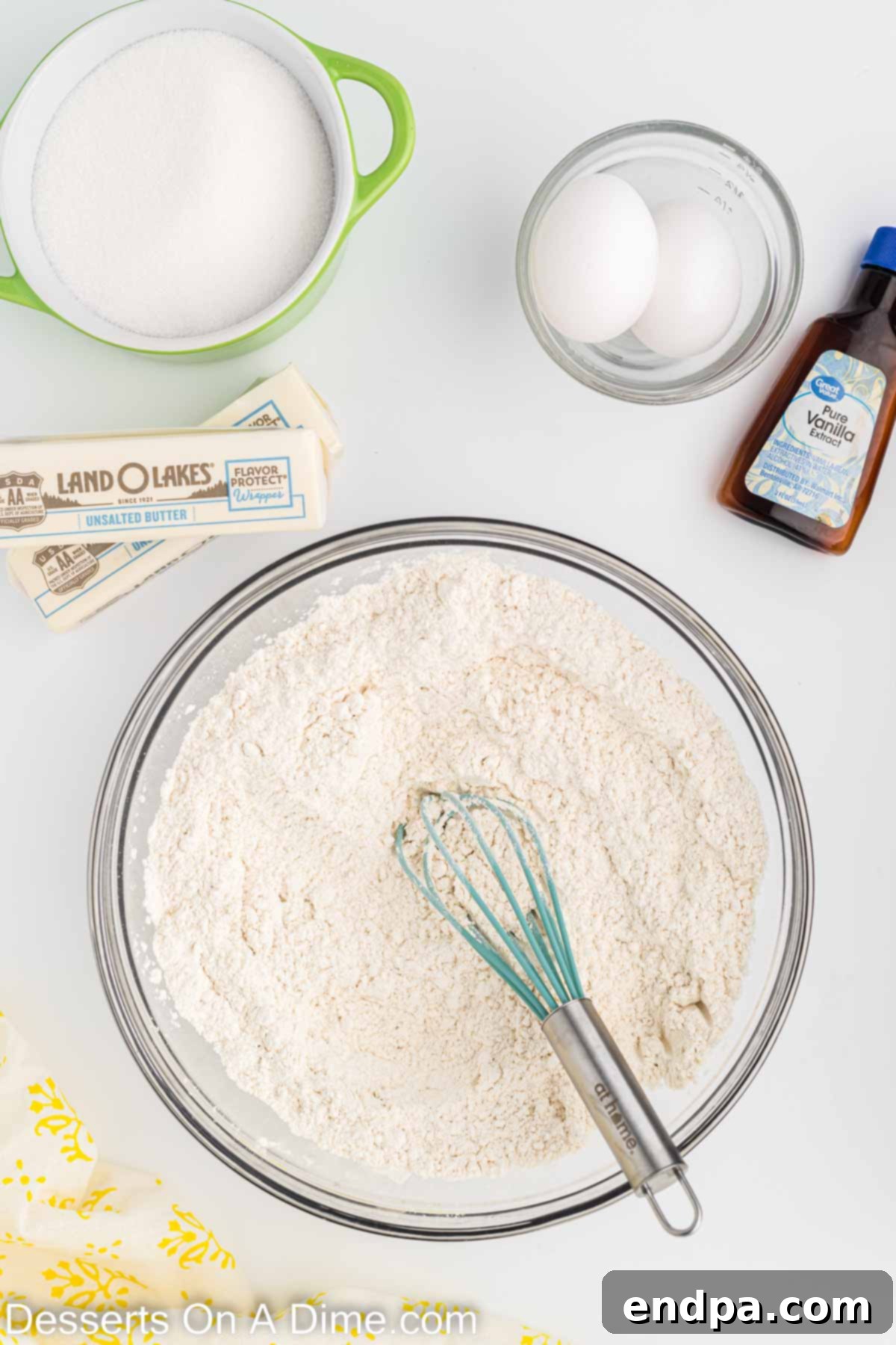 Holiday Tree Sugar Cookie Delights 4 A medium mixing bowl containing whisked dry ingredients for the sugar cookies: flour, baking powder, and salt.