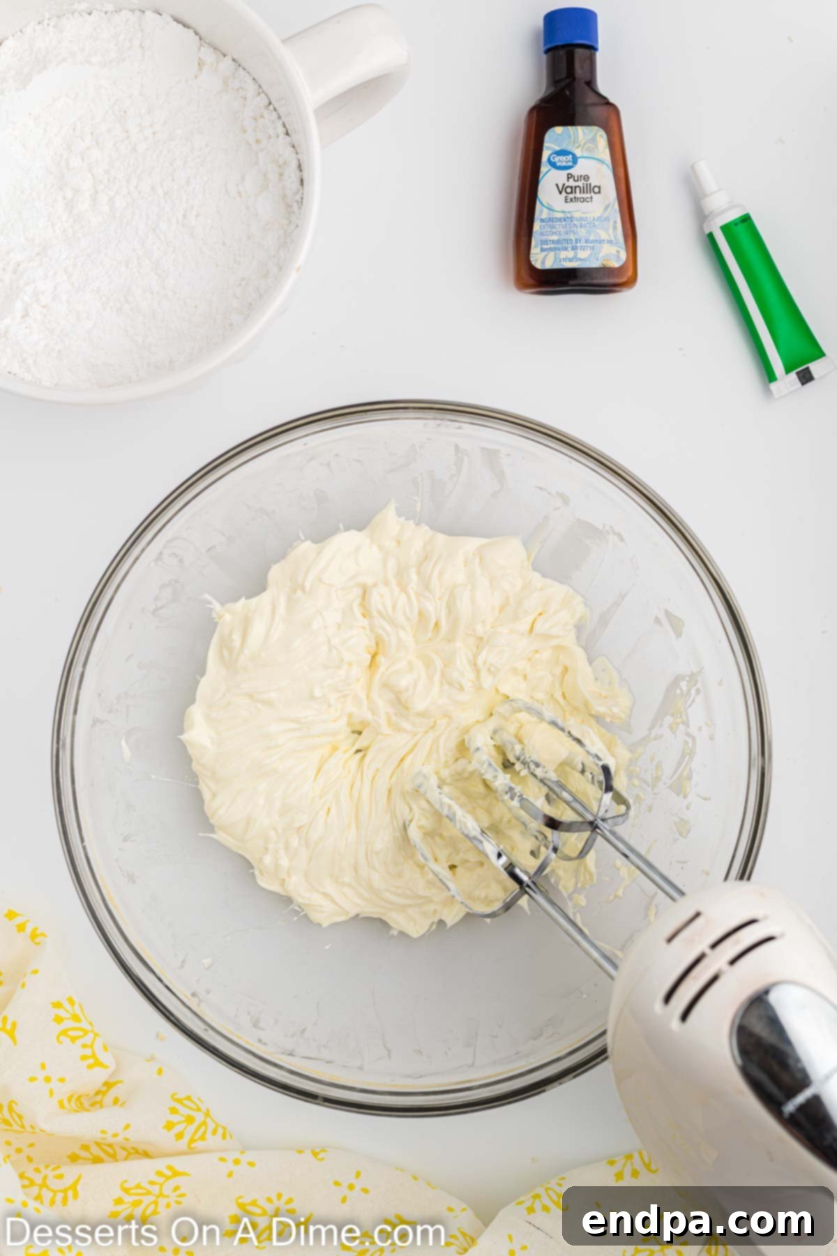 Holiday Tree Sugar Cookie Delights 8 A large mixing bowl with softened cream cheese and butter beaten together until smooth and creamy for the frosting.