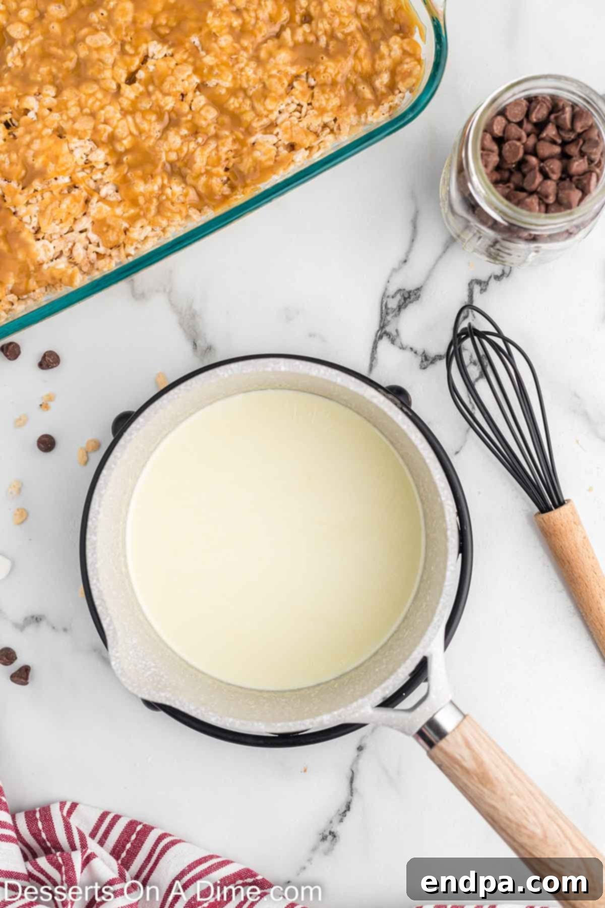 Heavy whipping cream heating in a saucepan for the chocolate topping.