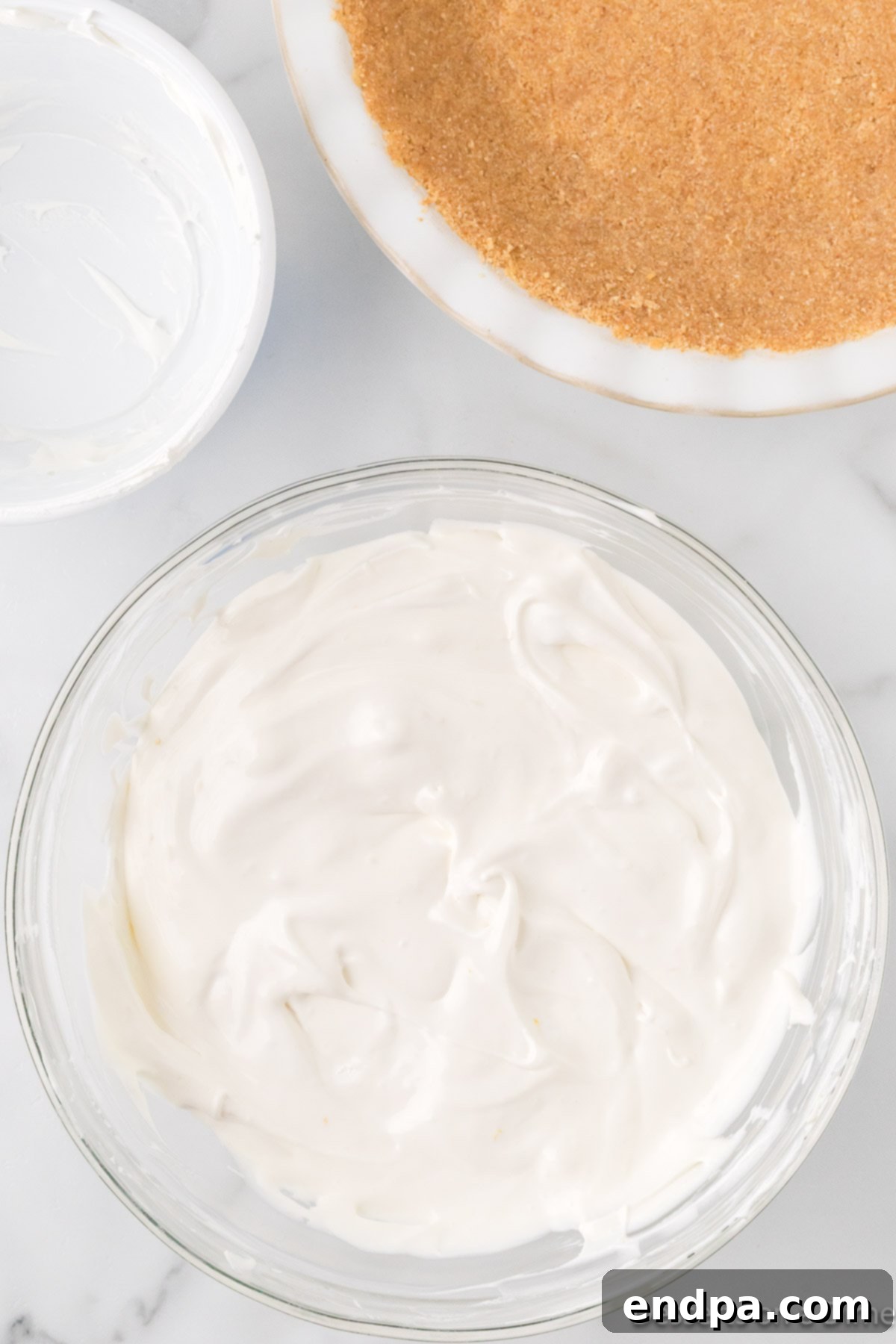 Cool Lemon Cloud Pie 8 Whipped topping being gently folded into the lemon filling mixture.